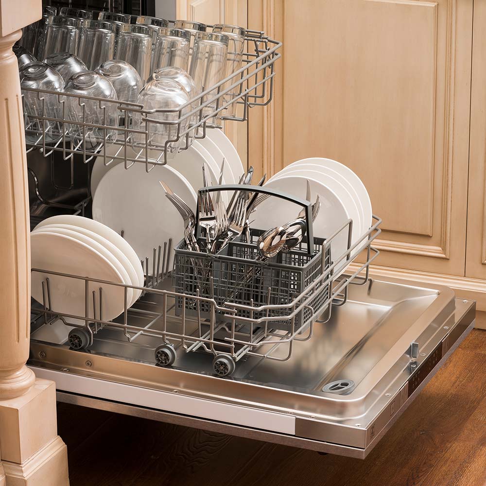 24-inch dishwasher loaded with plates, cups, and cutlery