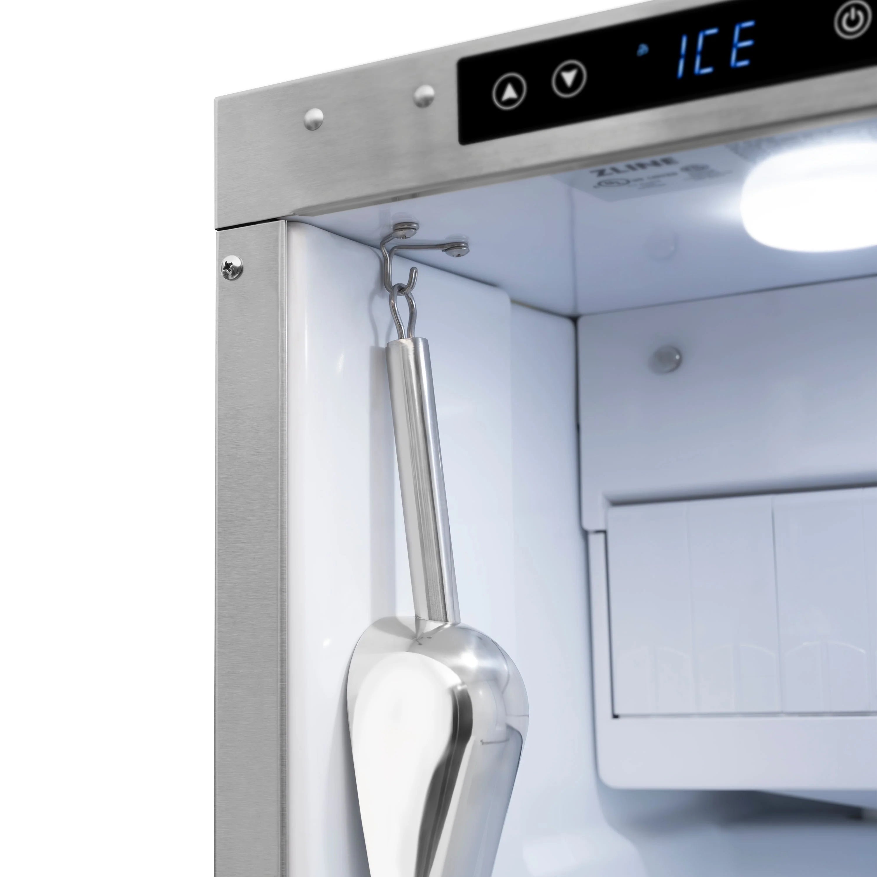 Ice maker interior dispenser arm with stainless scoop hanging from door