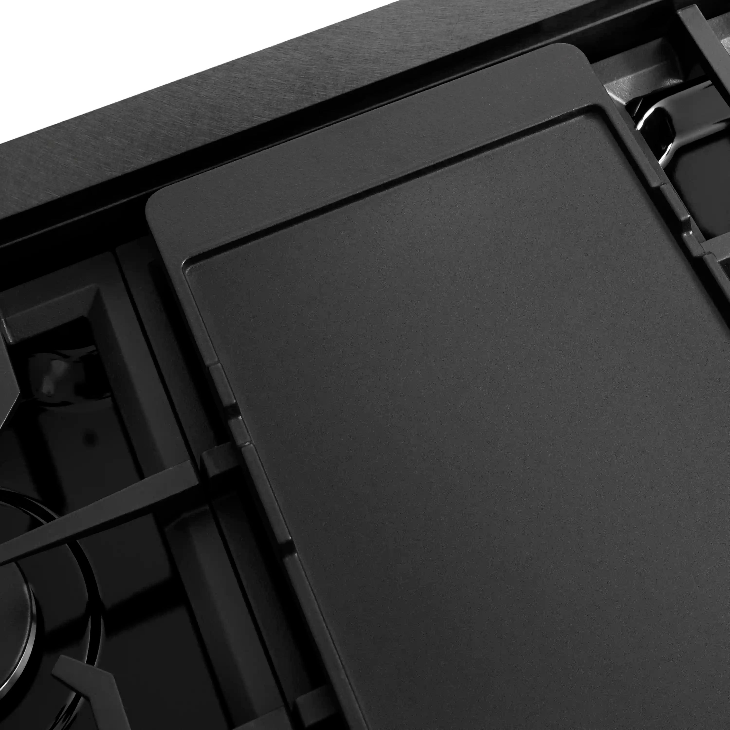 Black porcelain cooktop with removable griddle cover and burner grates