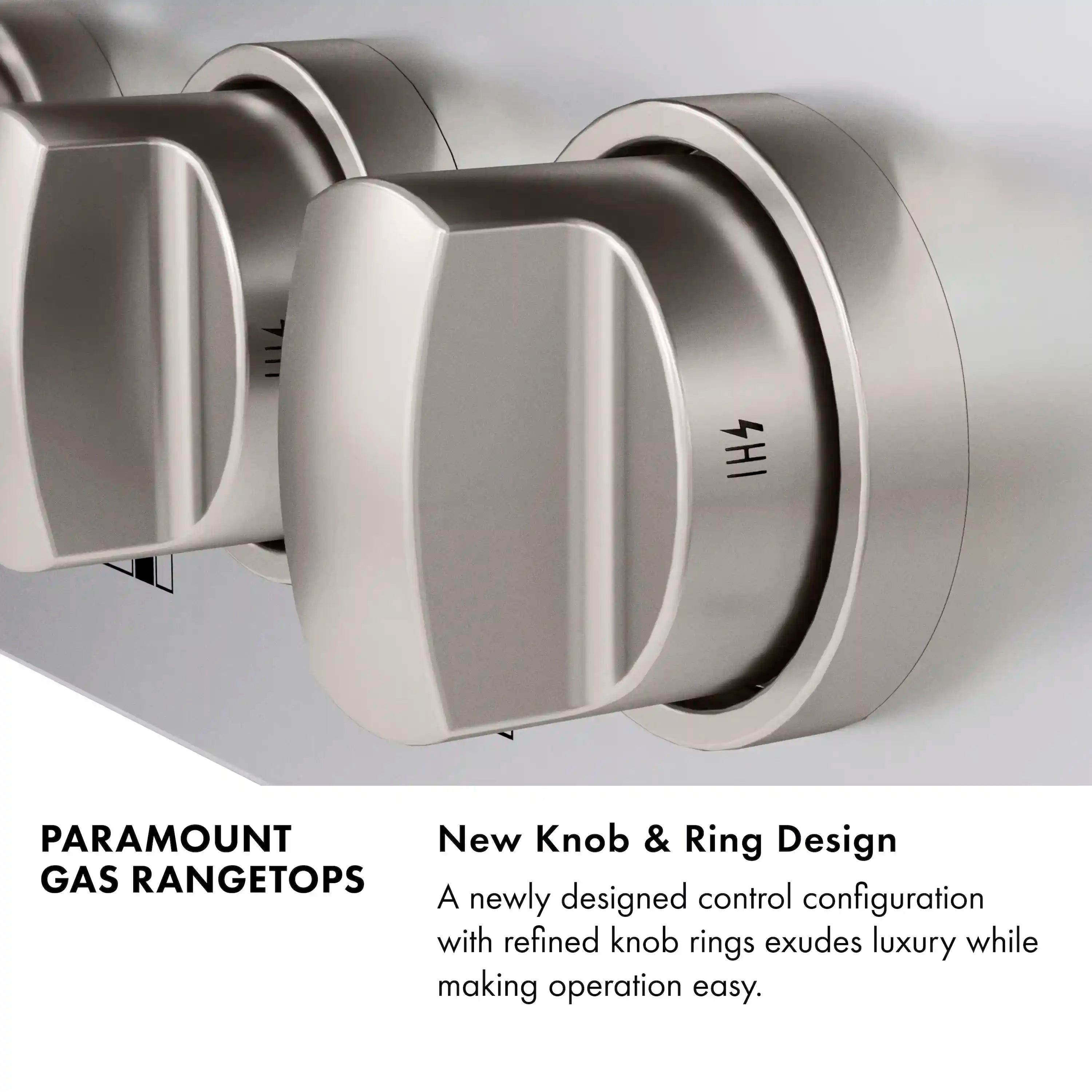 Stainless steel gas rangetop knobs with black burner rings and grates