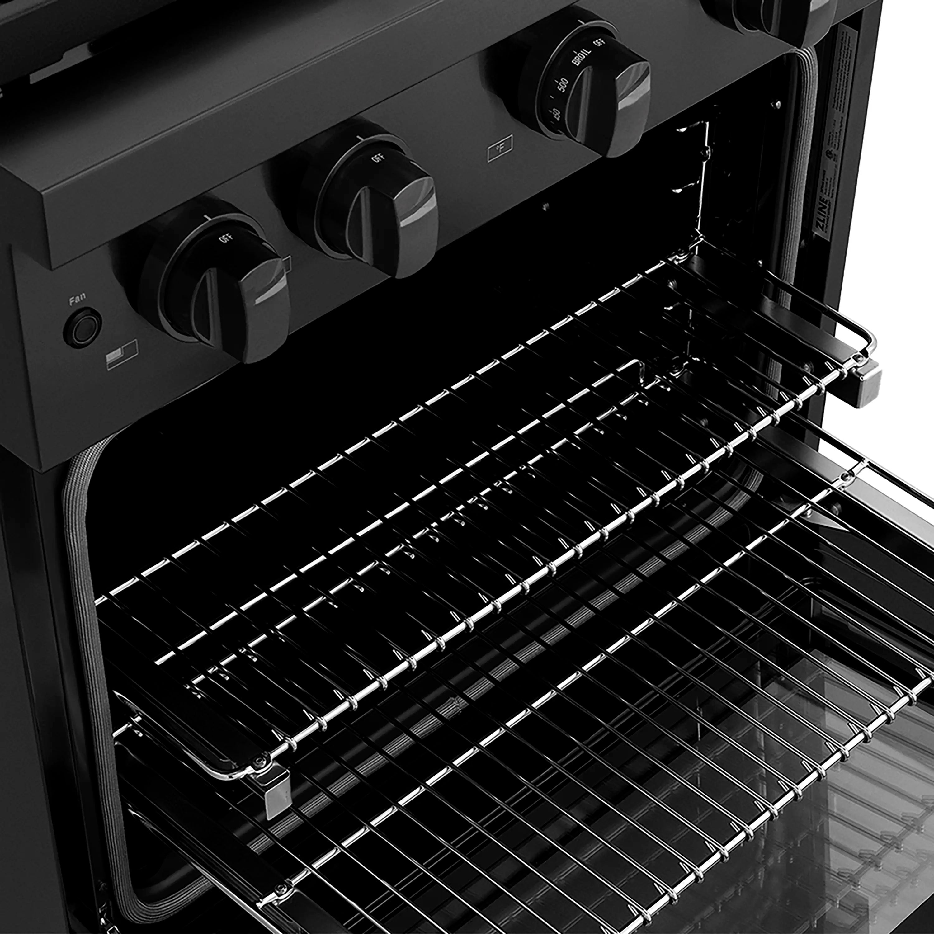 Black electric convection oven interior with wire oven racks and open door