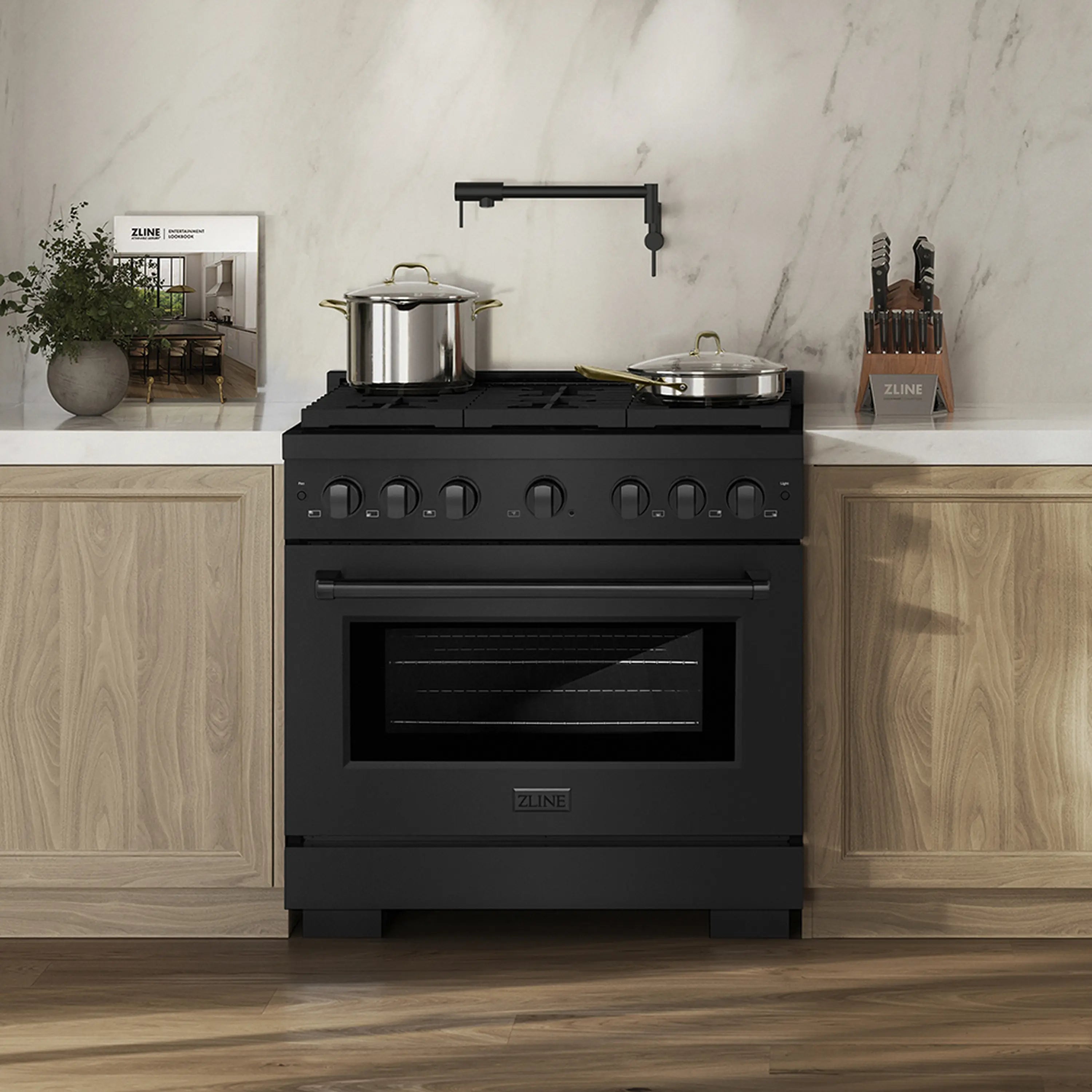 Black stainless steel dual fuel range in kitchen with cooktop and oven door