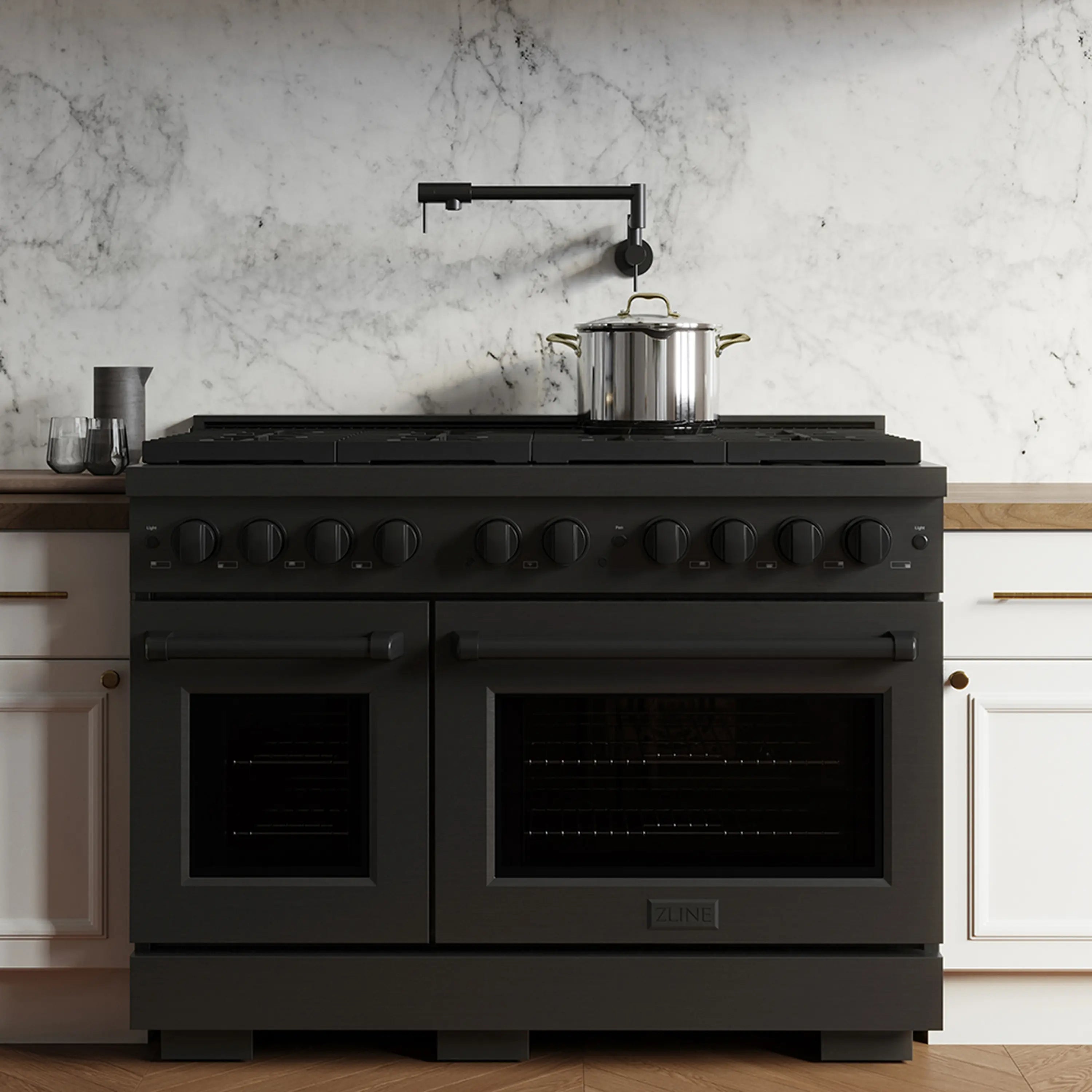 Black stainless dual fuel range with eight burners and dual oven doors, front view