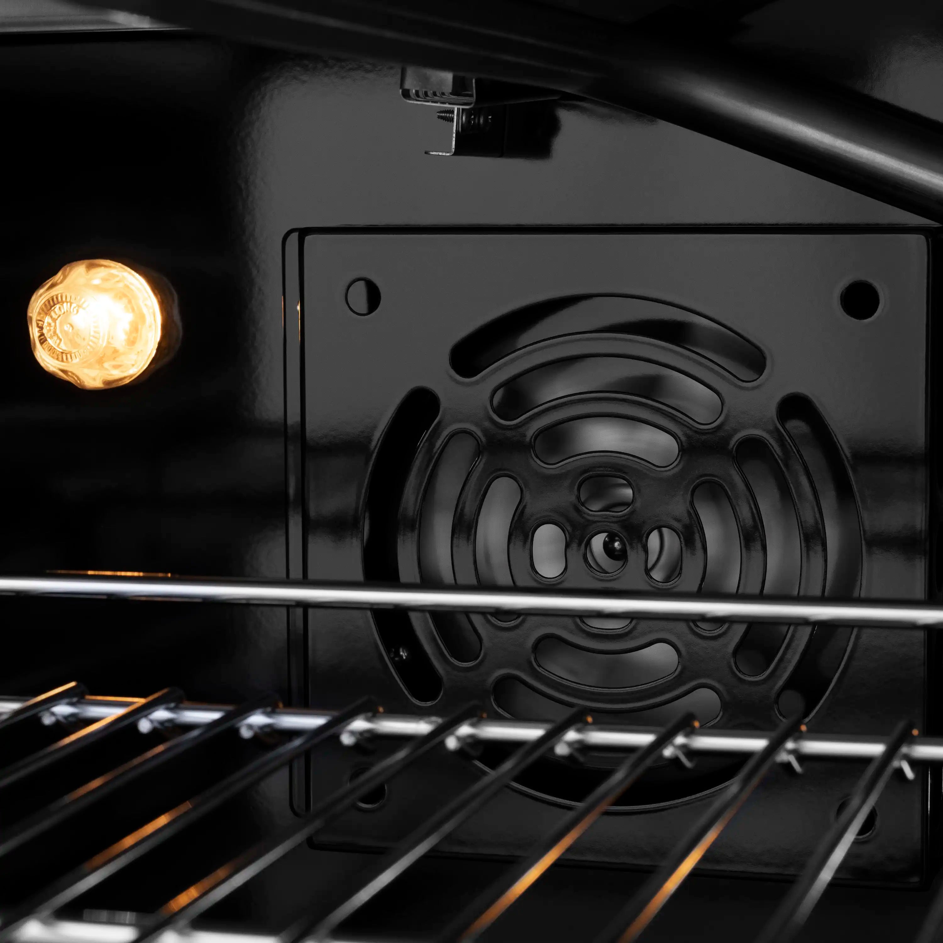 Black gas range oven cavity with racks and interior control panel