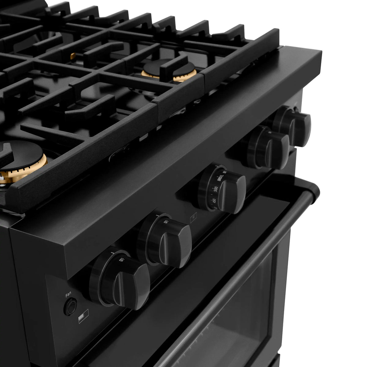 Black stainless cooktop with burner grates, brass accents, and control knobs close-up