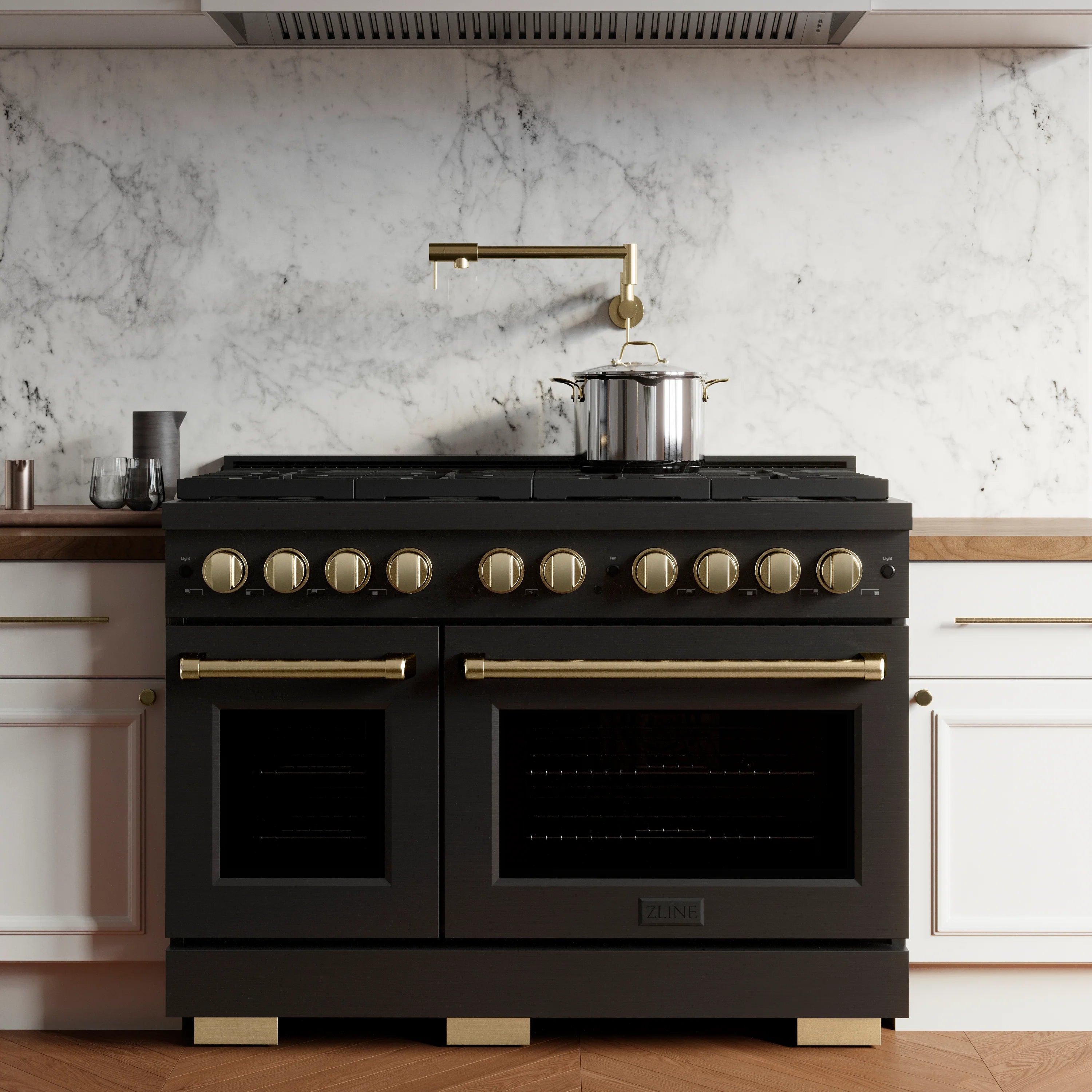 Gas range with black stainless finish, gold accents, 8 burners, and double oven doors
