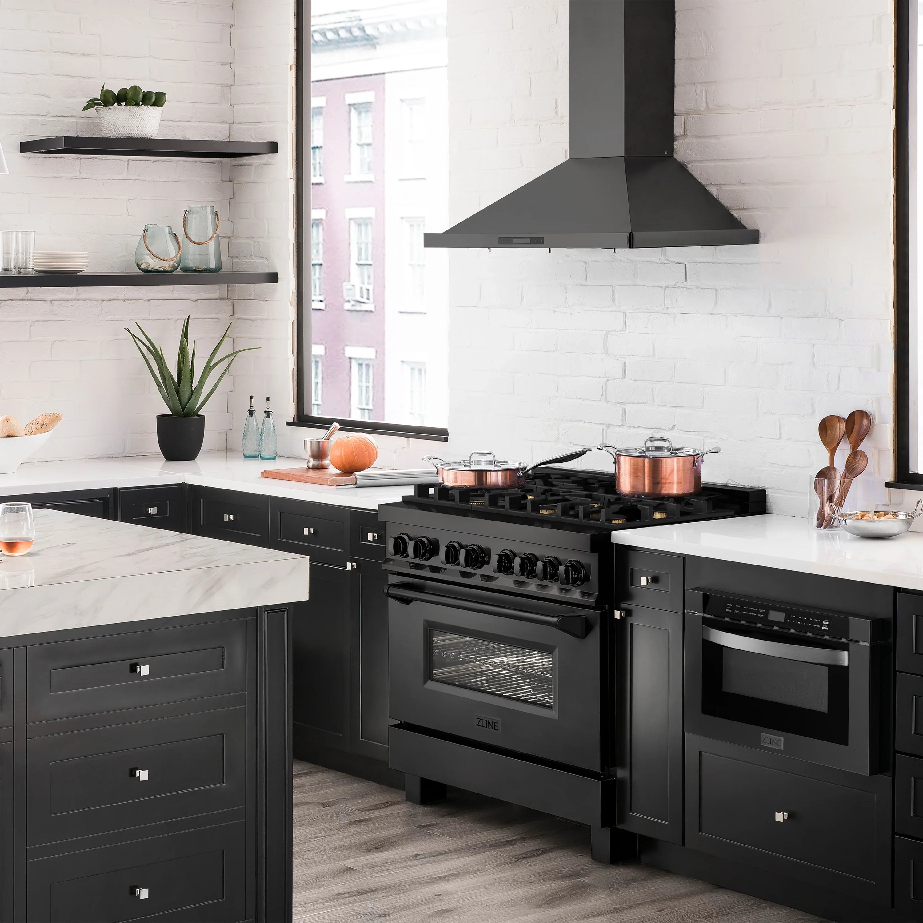 Black dual fuel range with cooktop burners and oven door