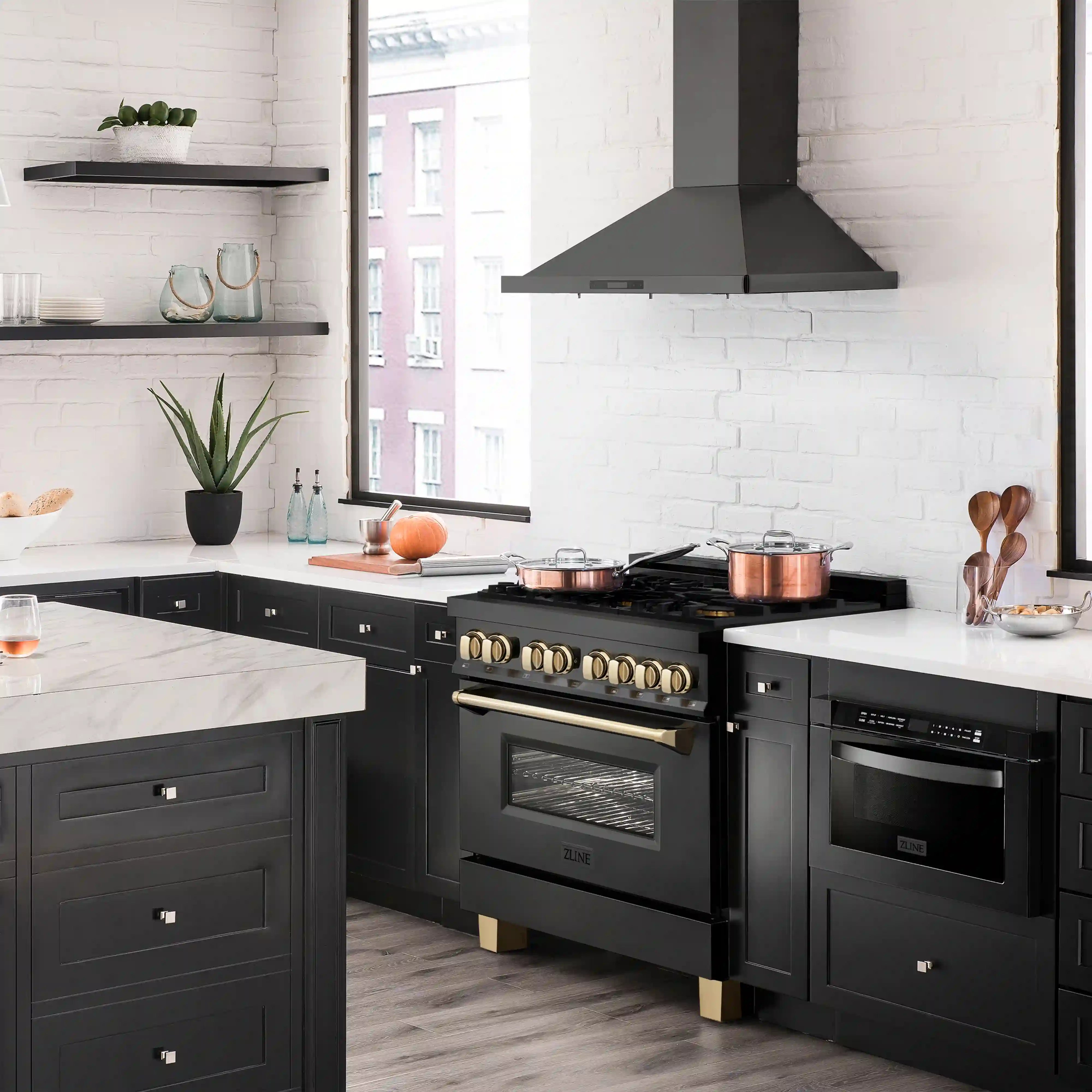 Black stainless dual-fuel range with gold control knobs and six-burner cooktop