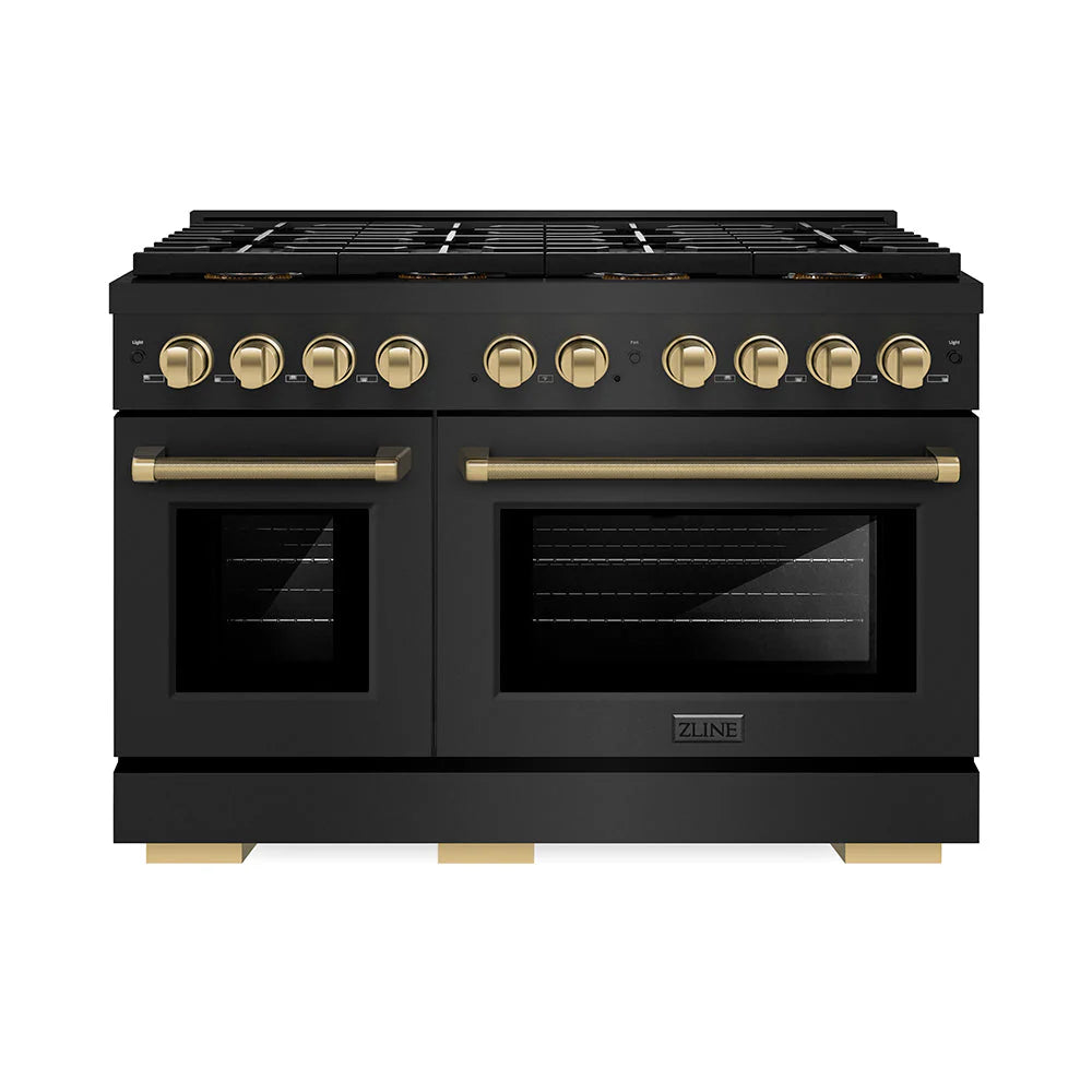 Black gas range with bronze knobs and two glass-front oven doors