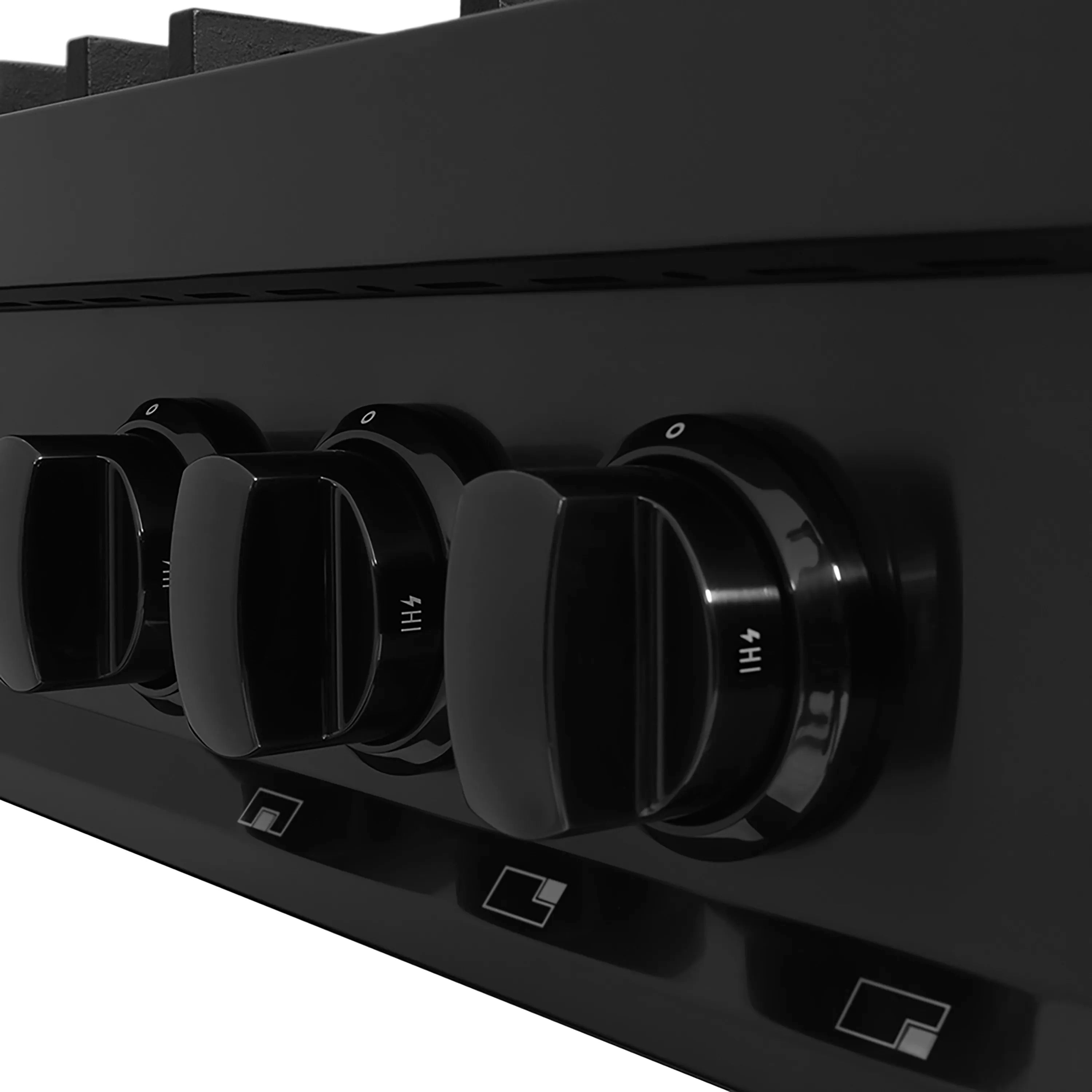 Black gas rangetop control knobs on front panel with burner markings
