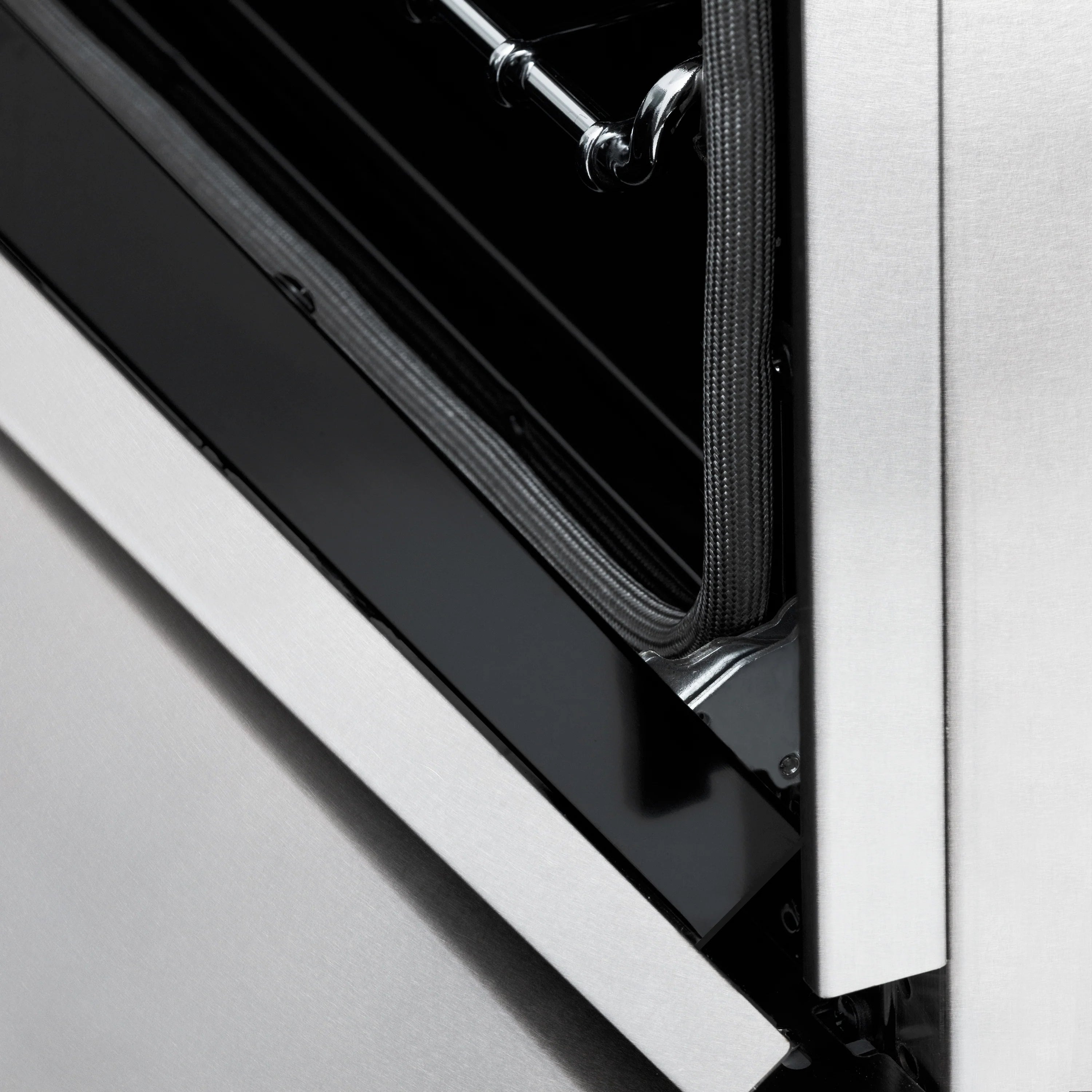Dual fuel oven door seal and interior gasket detail in satin stainless