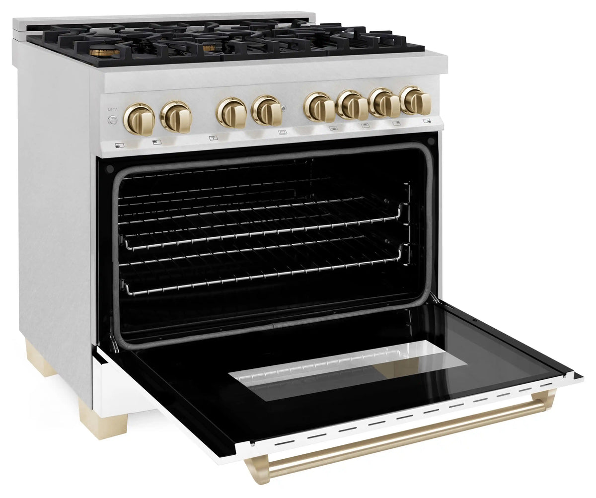 Dual-fuel range with oven door open, black interior, and gold handle accents