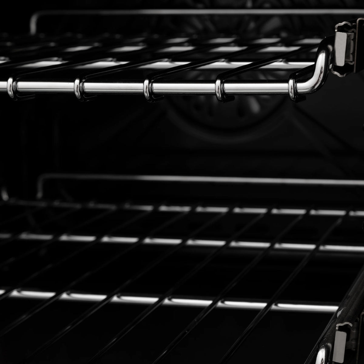 Electric oven interior with chrome rack and black oven cavity