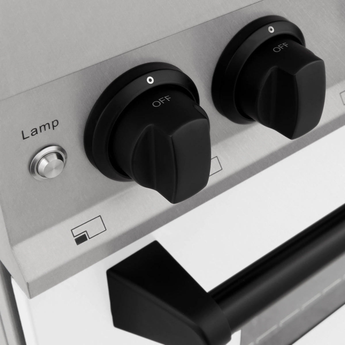 Control knob set with OFF markings and indicator icons on stainless range panel