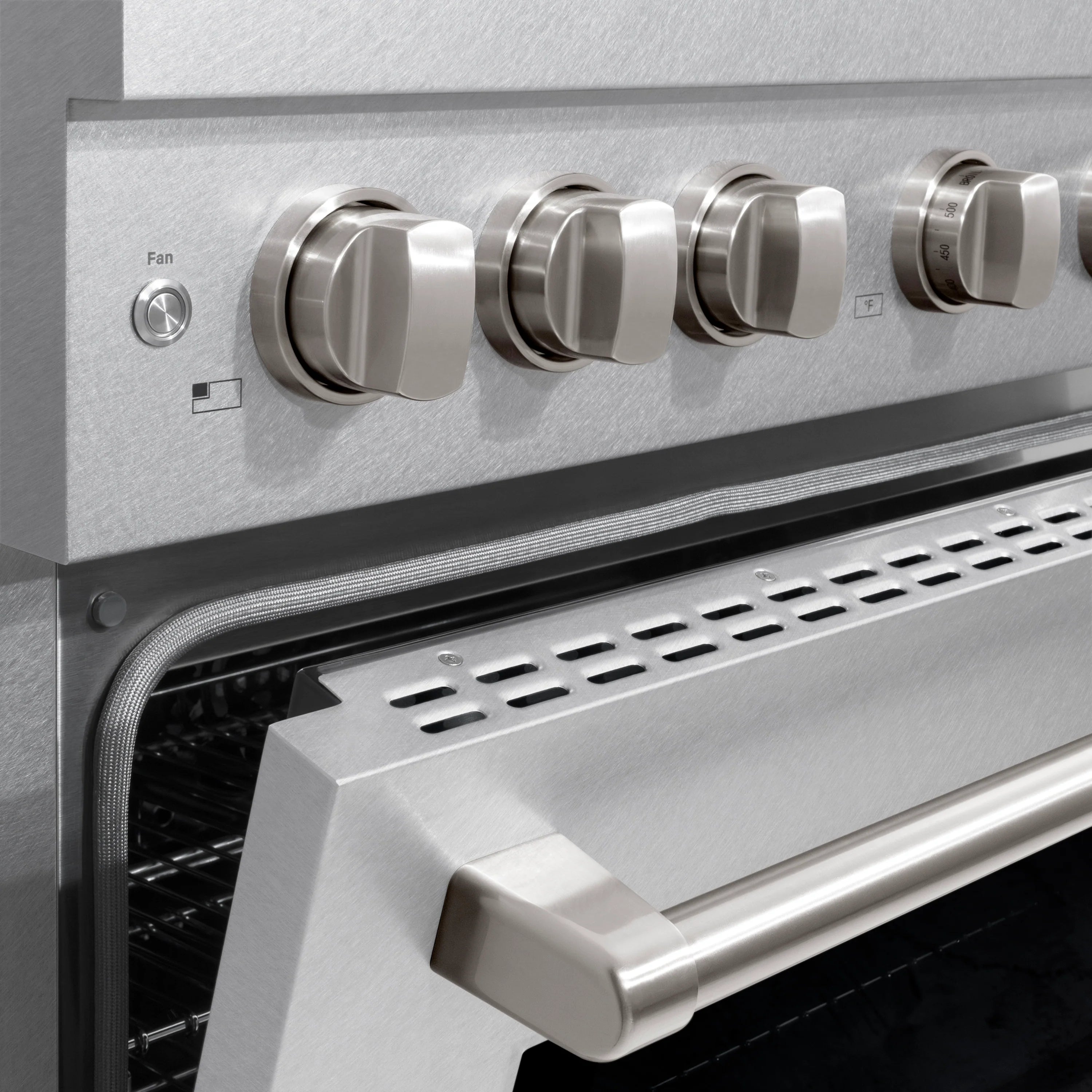 Stainless steel wall hood with fan control knobs and front vent grille
