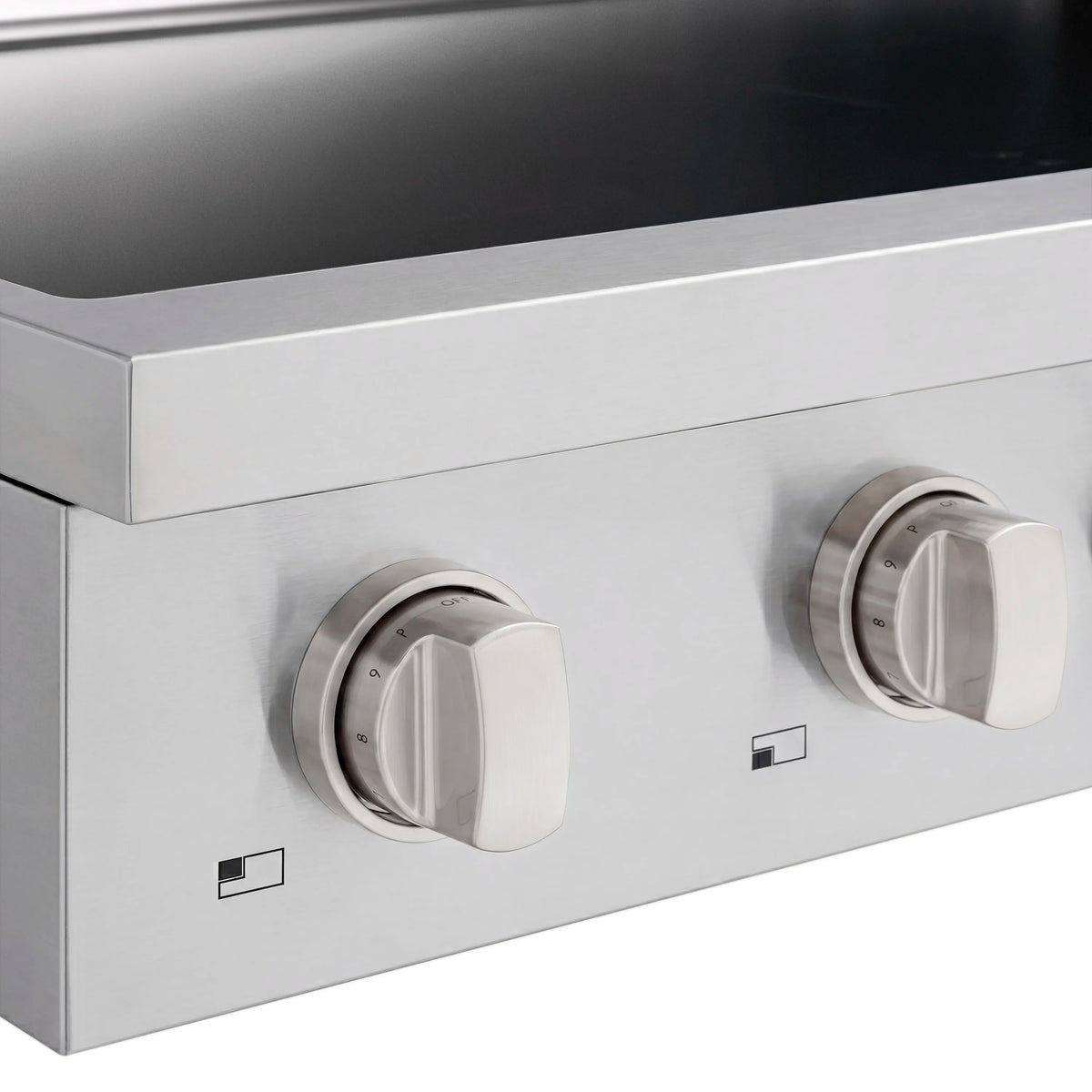 Stainless induction cooktop control knobs with numbered dial and power icons