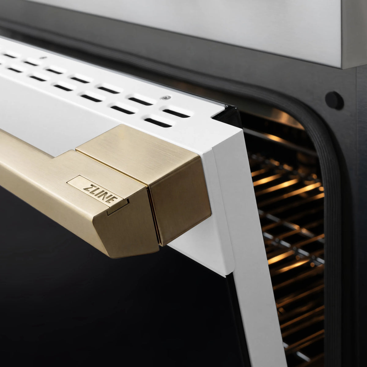 Gold-trim control box on white oven front with oven racks visible inside