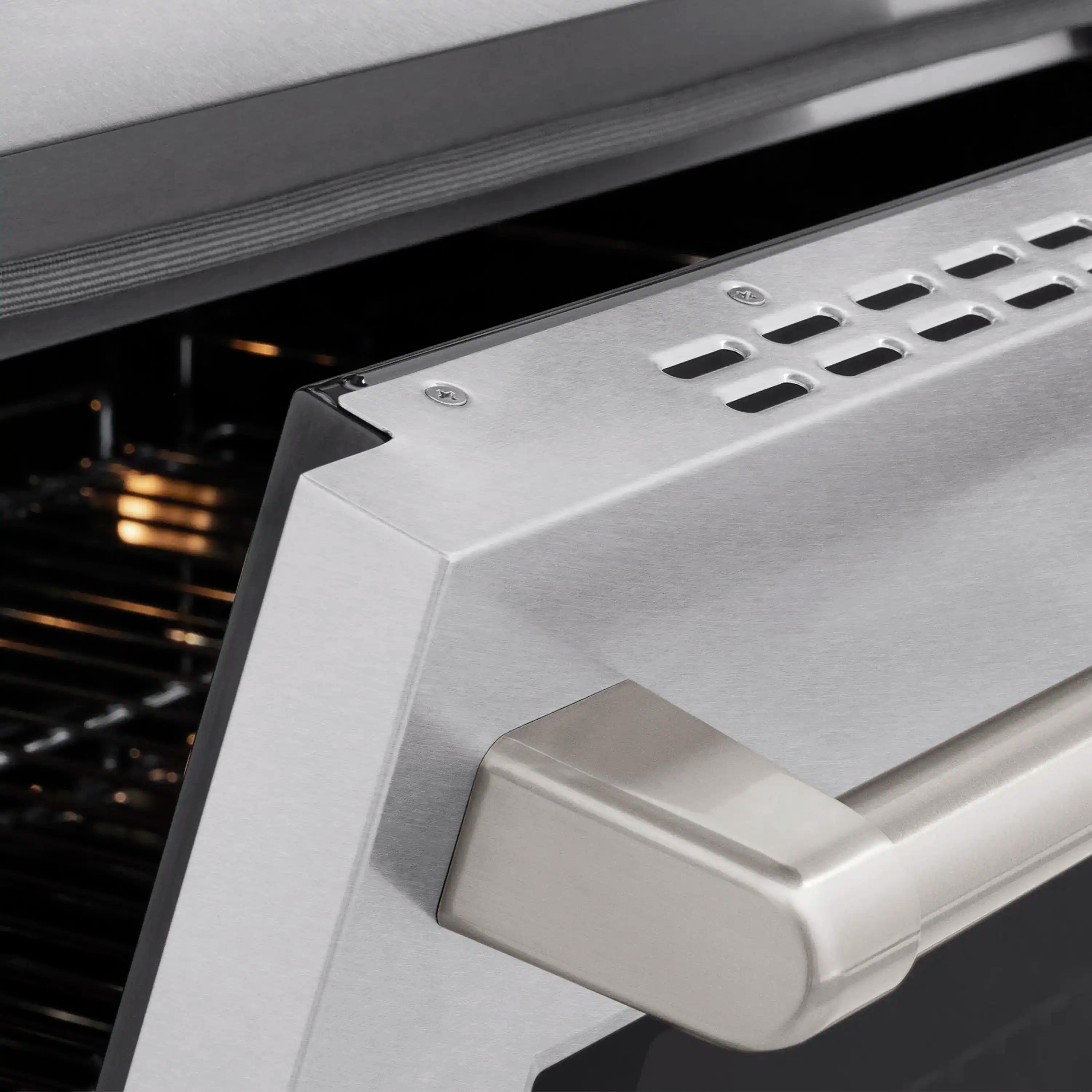 Stainless oven door handle with vented control panel detail