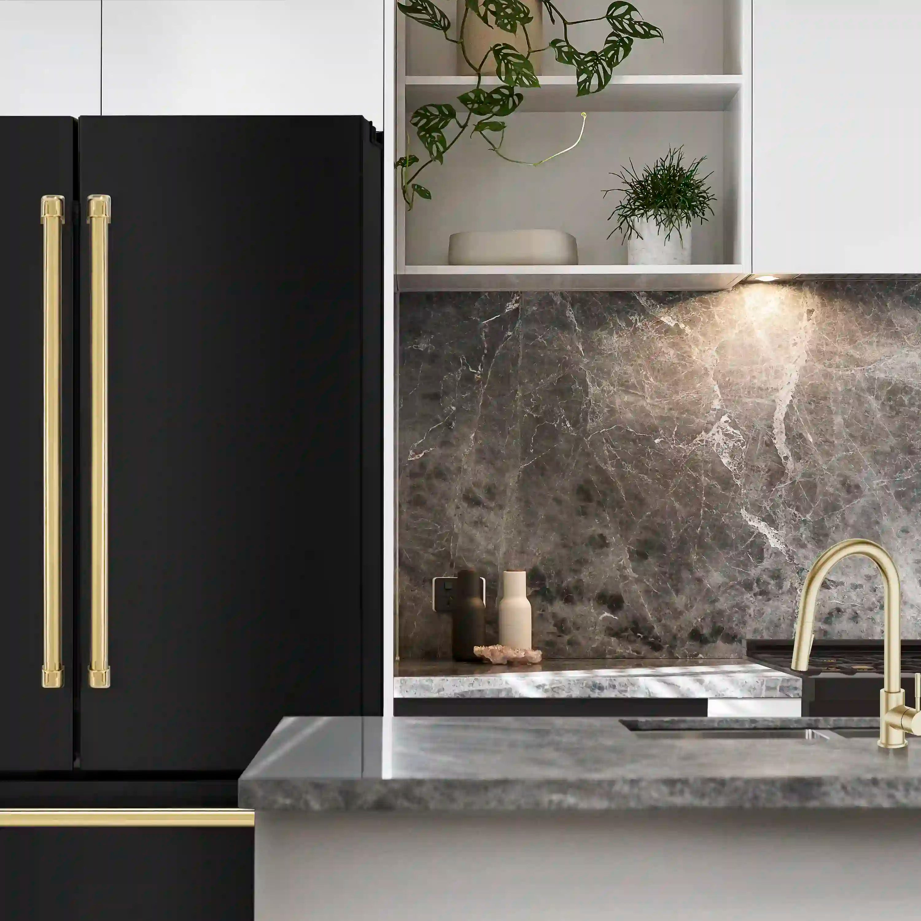 Black stainless steel French door refrigerator with gold handle accents