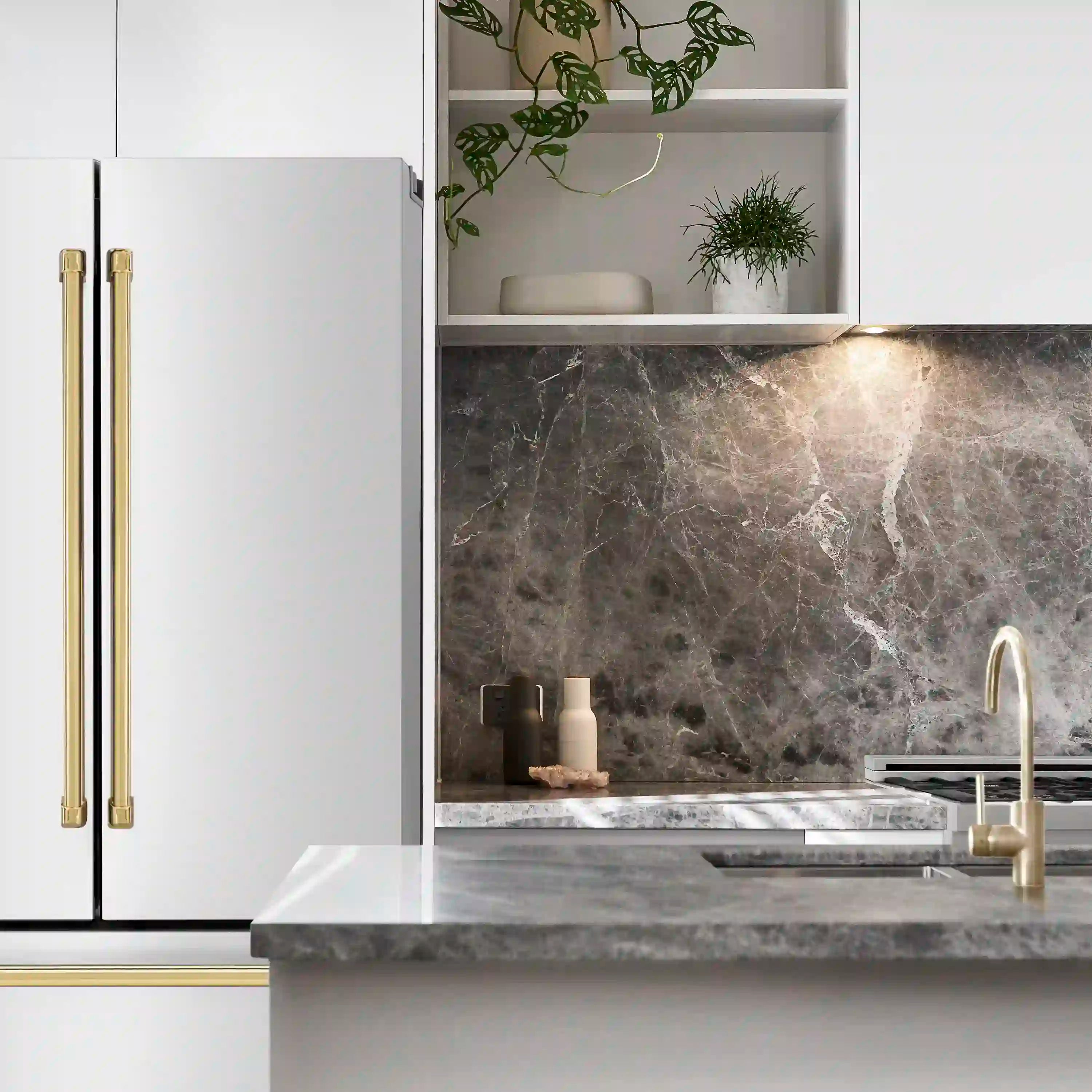 Freestanding French door refrigerator with gold-trimmed doors and interior shelves