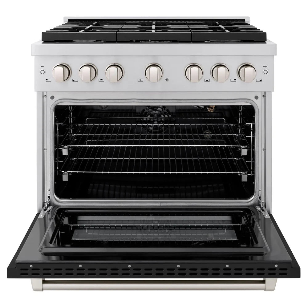 Open gas oven of a stainless steel range with racks and control knobs