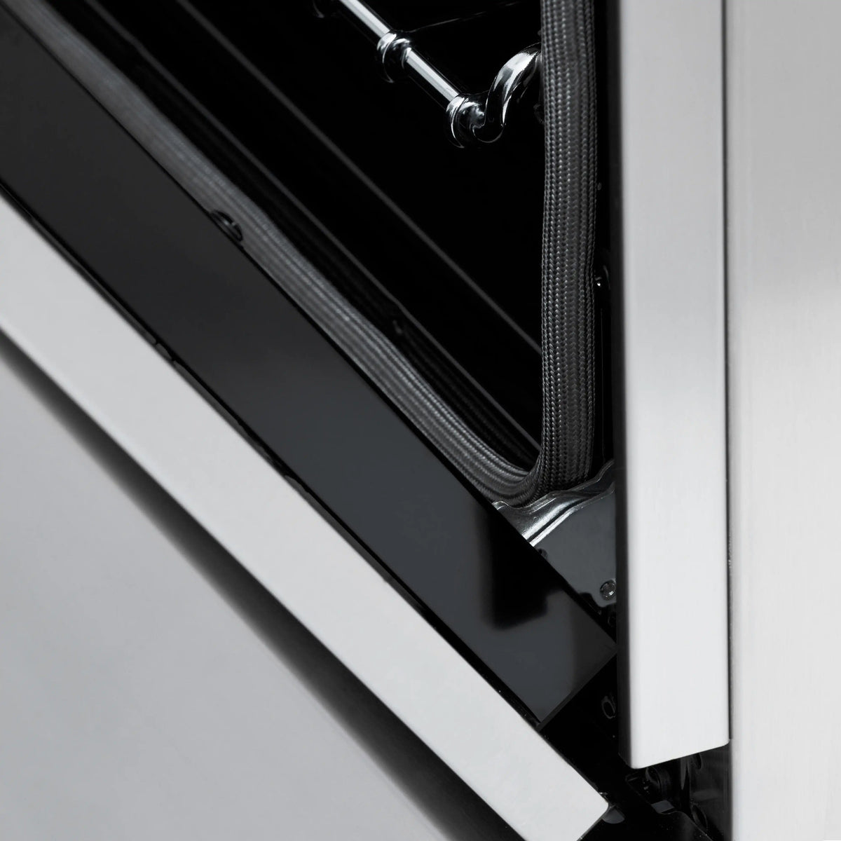 Stainless steel range control panel with black oven door and handle