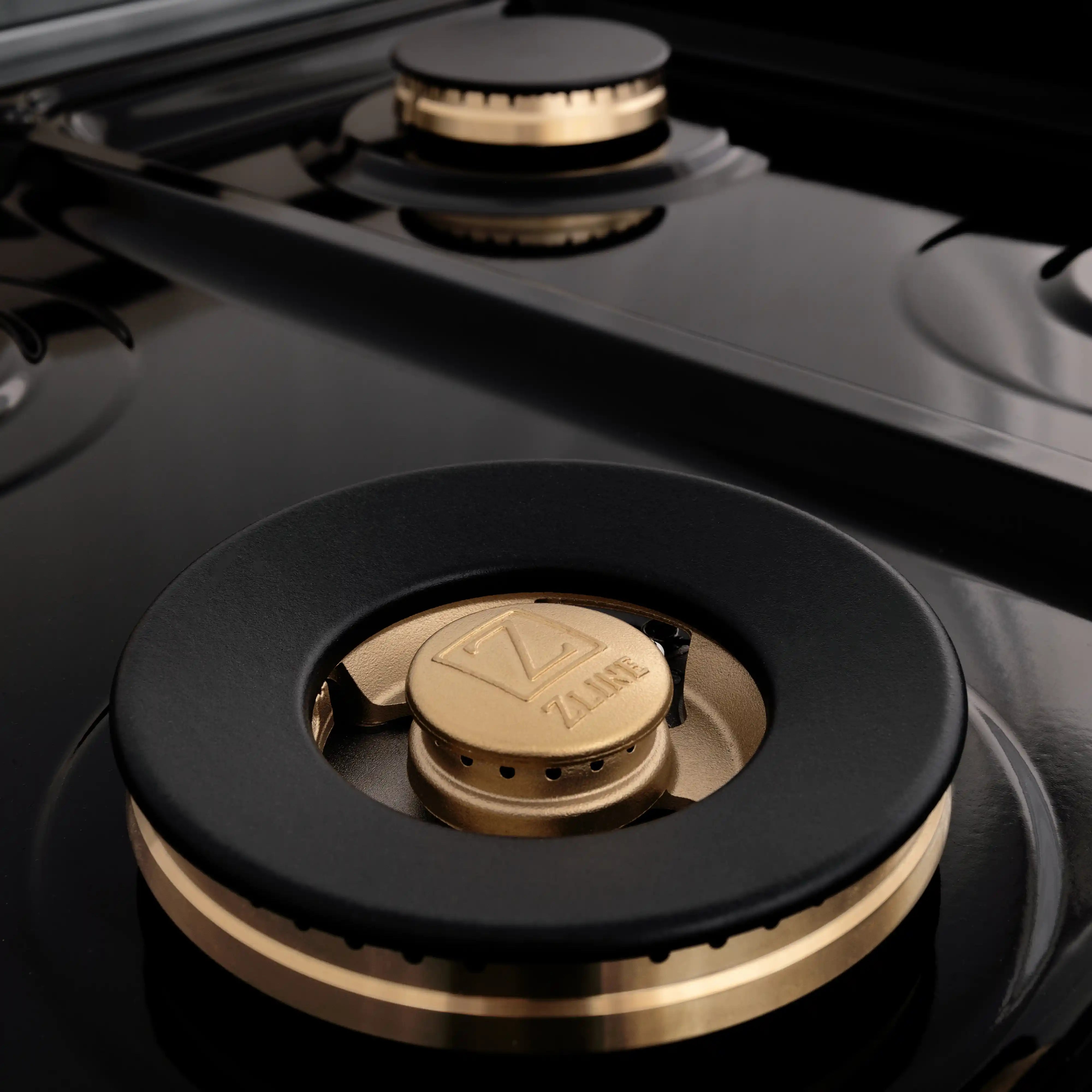 Close-up of ZLINE gas burner cap with black top and gold ring