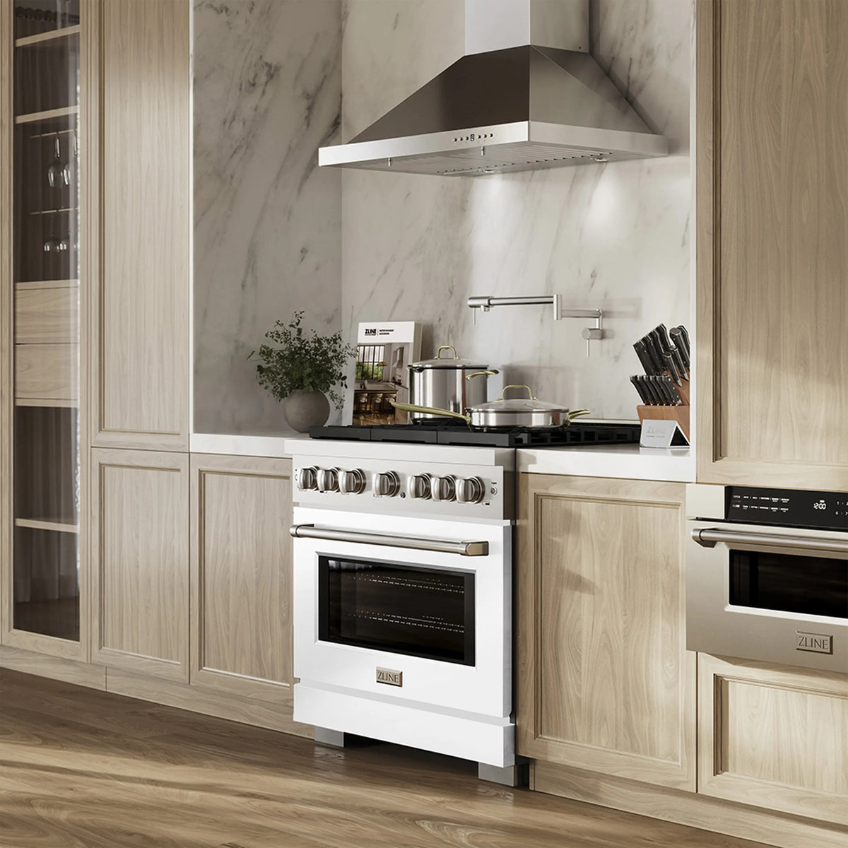 White dual fuel range installed in kitchen with oven door and cooktop grates visible
