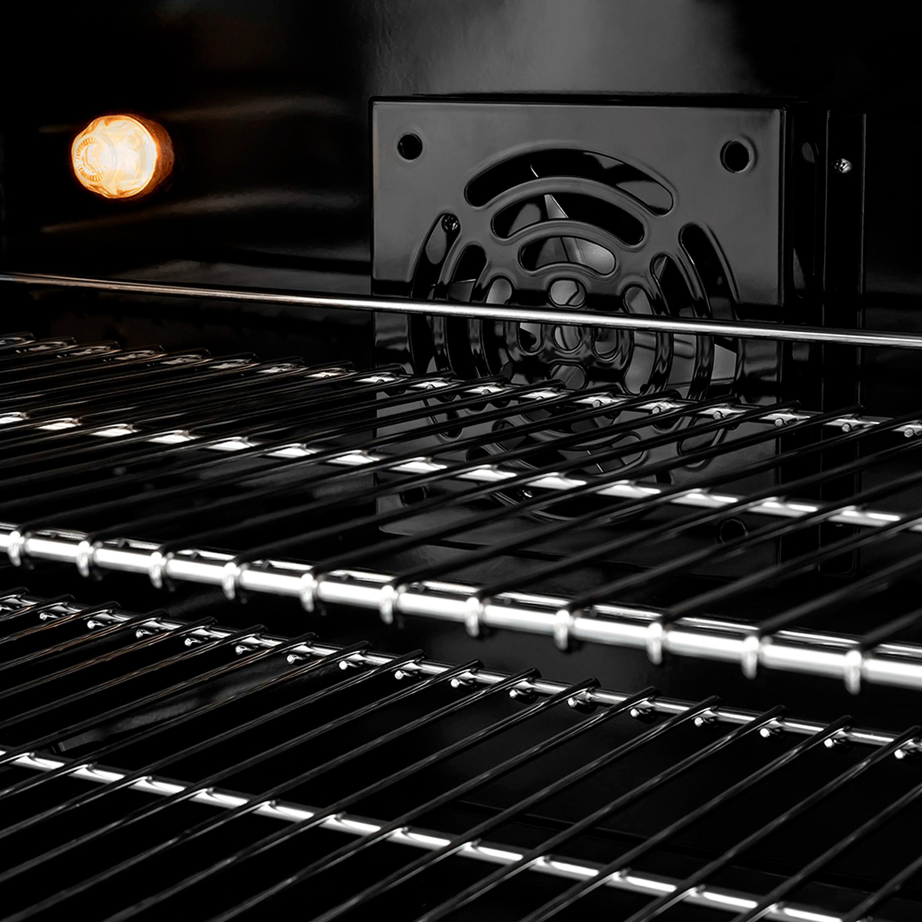 Stainless gas range cooktop with illuminated burner and black grate