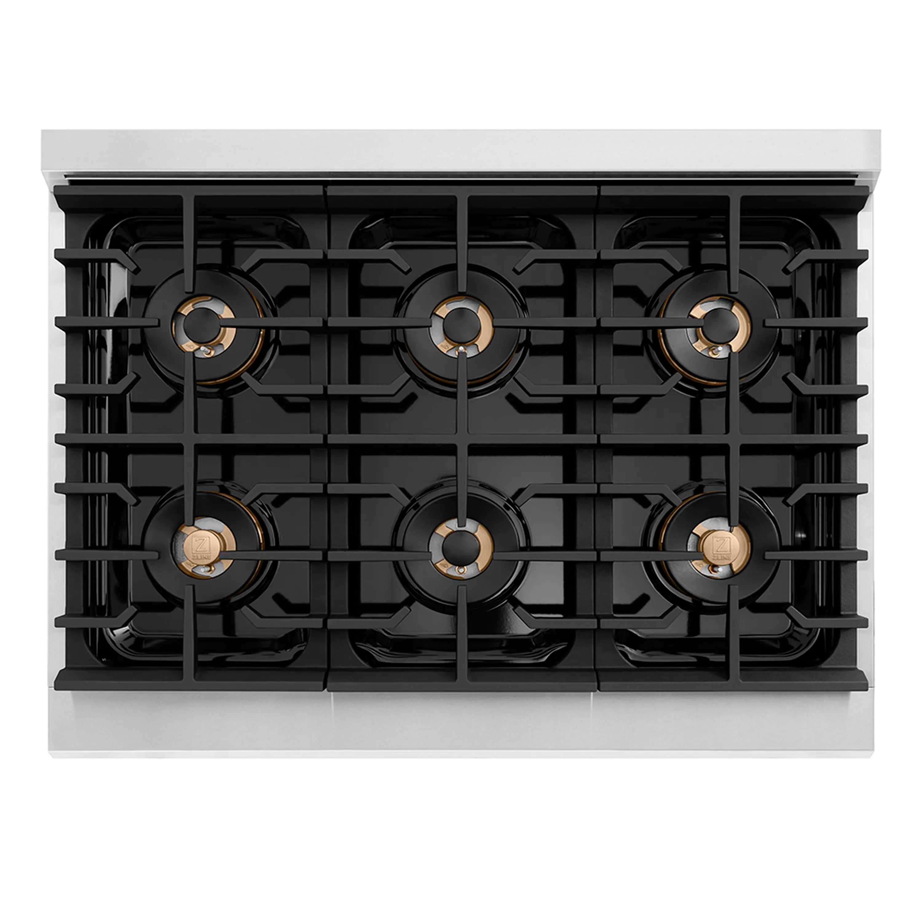 Cooktop view with five black grates and gold-trimmed burner caps
