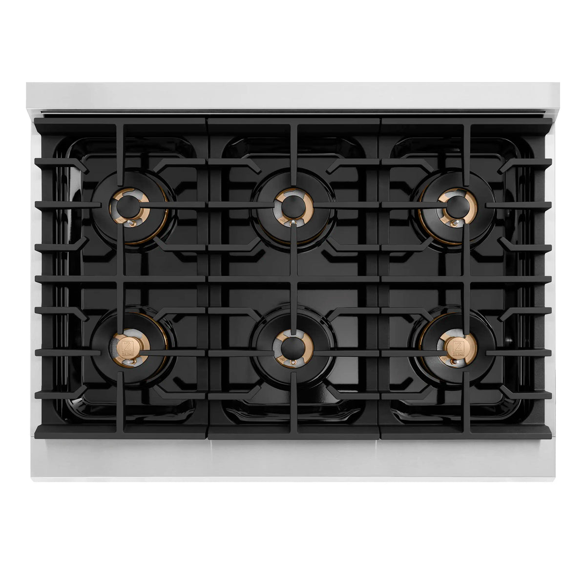 Stainless steel dual fuel cooktop with black grates and bronze burner knobs