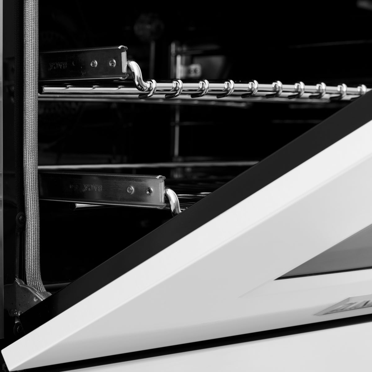 Dual fuel range oven interior with chrome racks and wire shelf rails