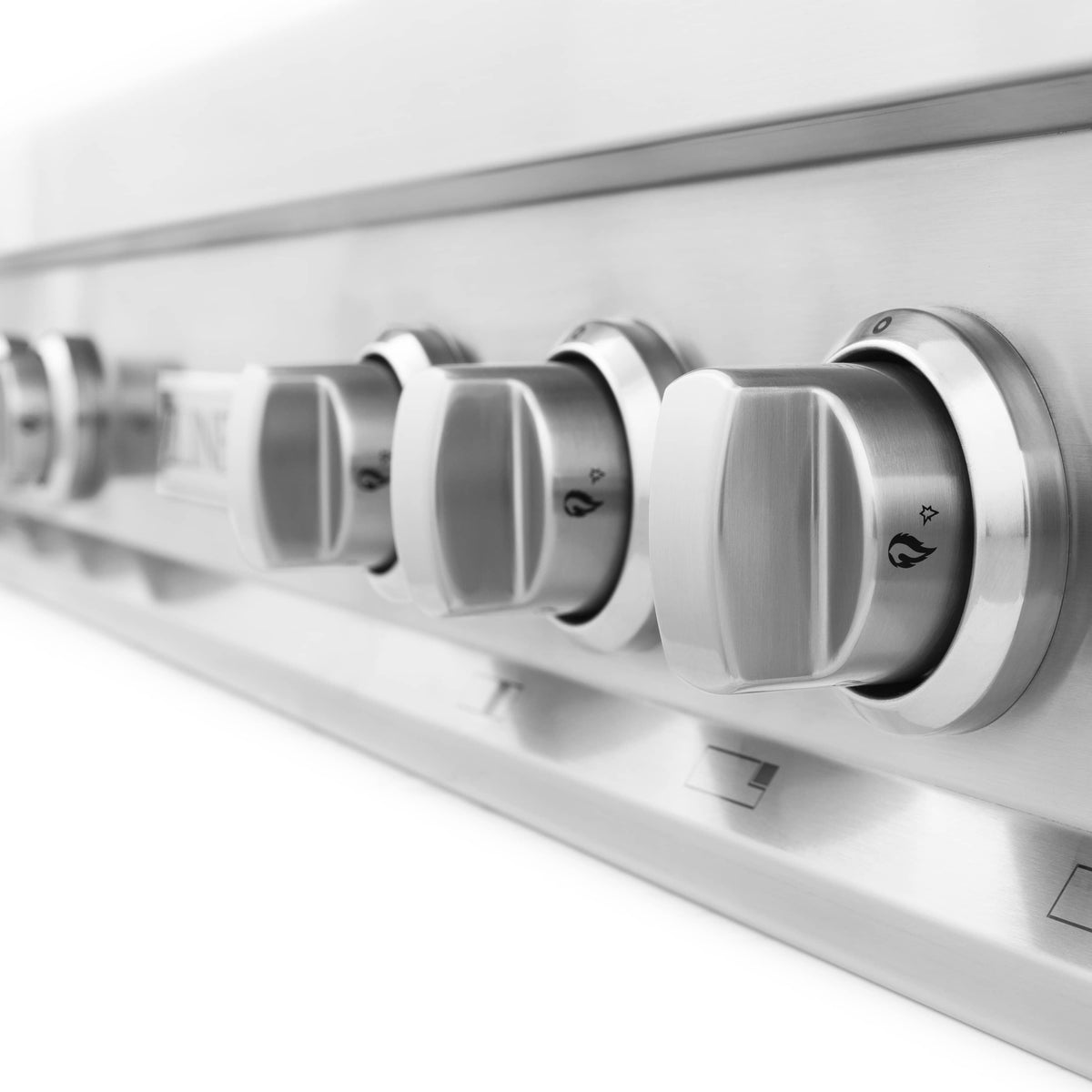 Close-up of stainless steel rangetop control knobs with ZLINE branding