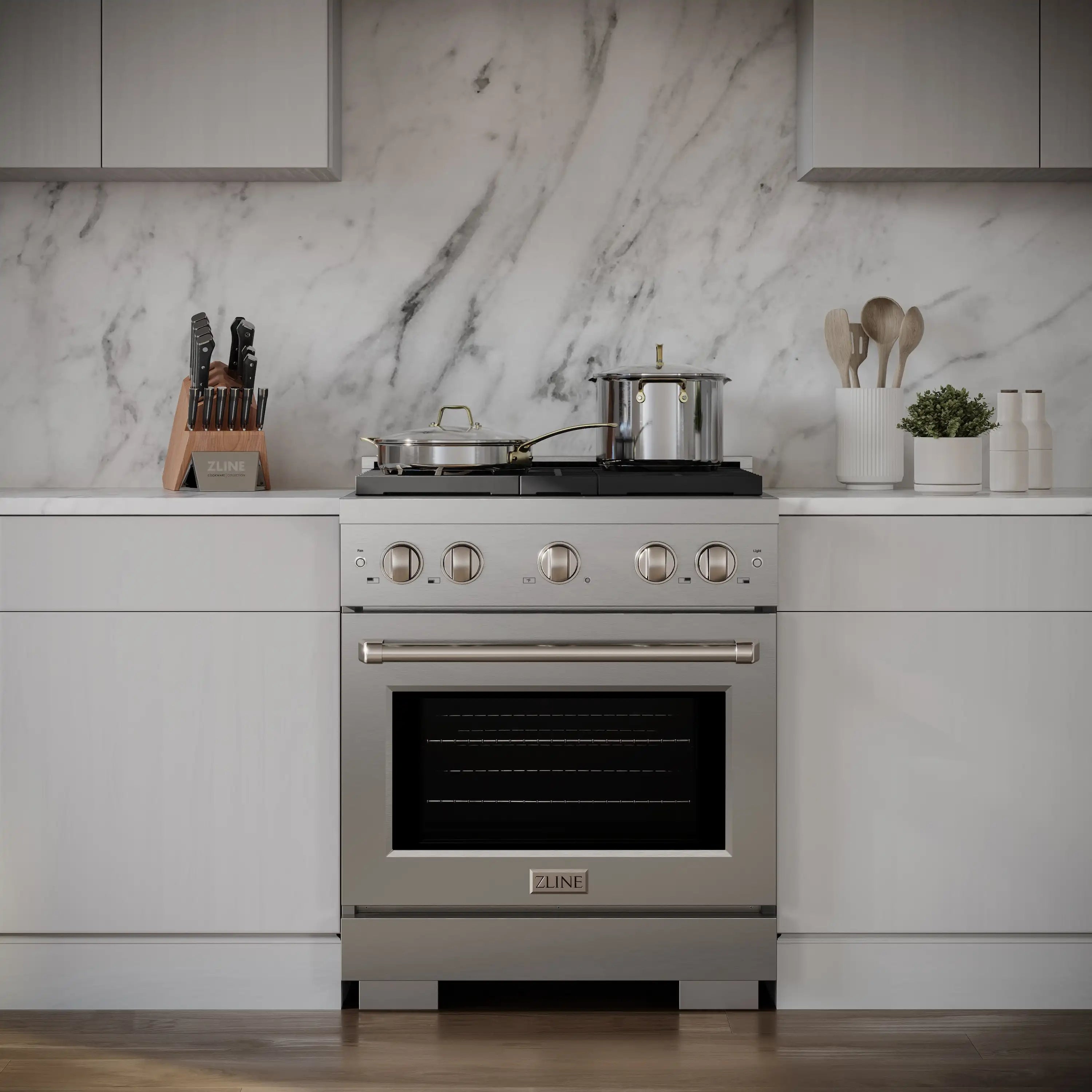 Stainless dual-fuel range in modern kitchen with gas cooktop and oven door
