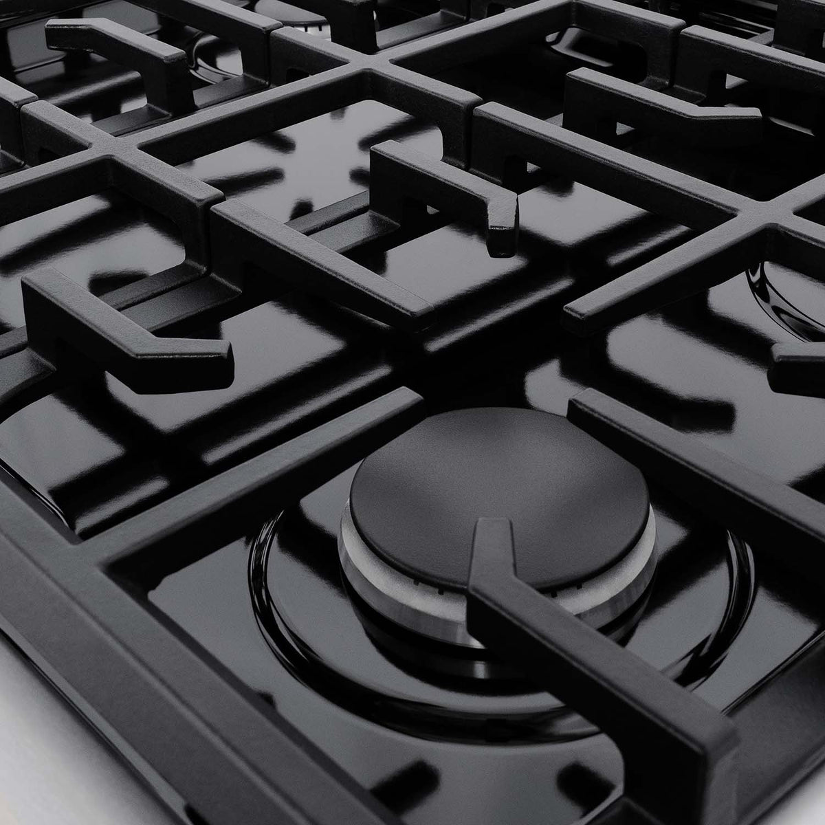 Black cast-iron burner grate with surrounding burner rings on stainless range top