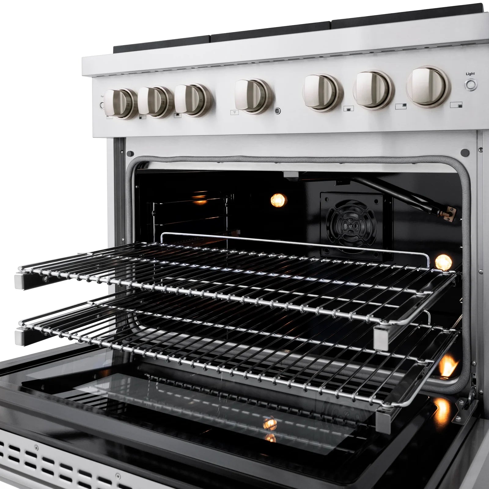 Stainless steel gas oven with open door, illuminated interior, and racks