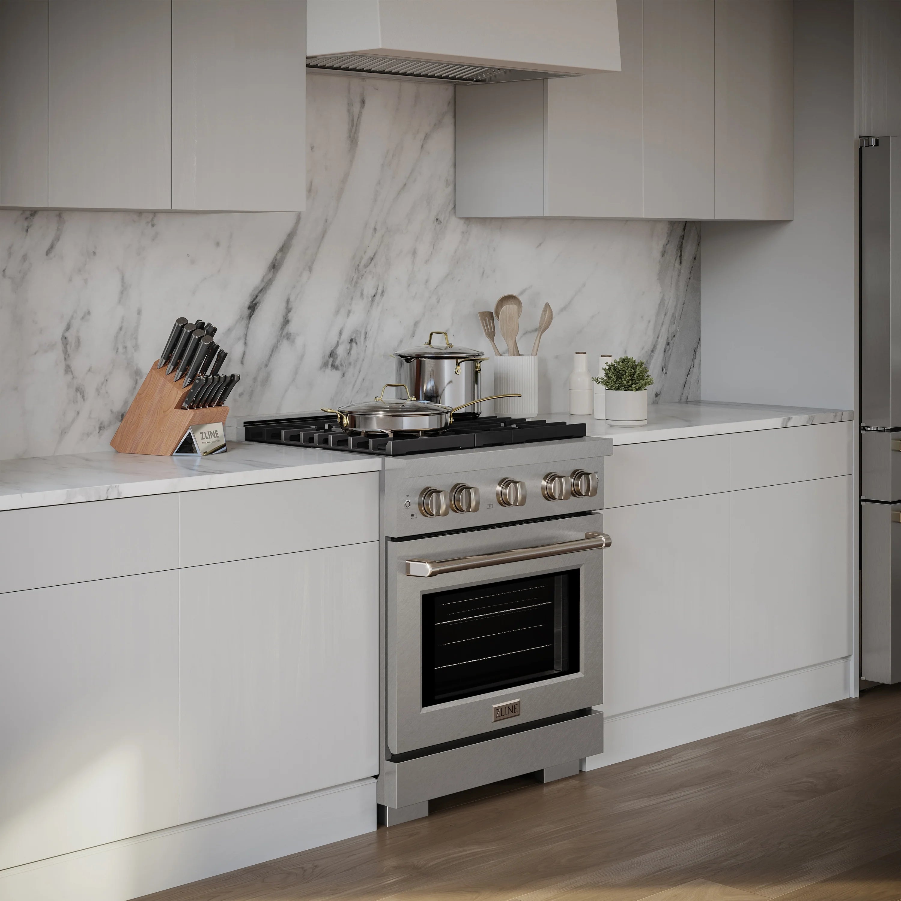 Satin stainless steel range with convection oven, four burners, and storage drawer