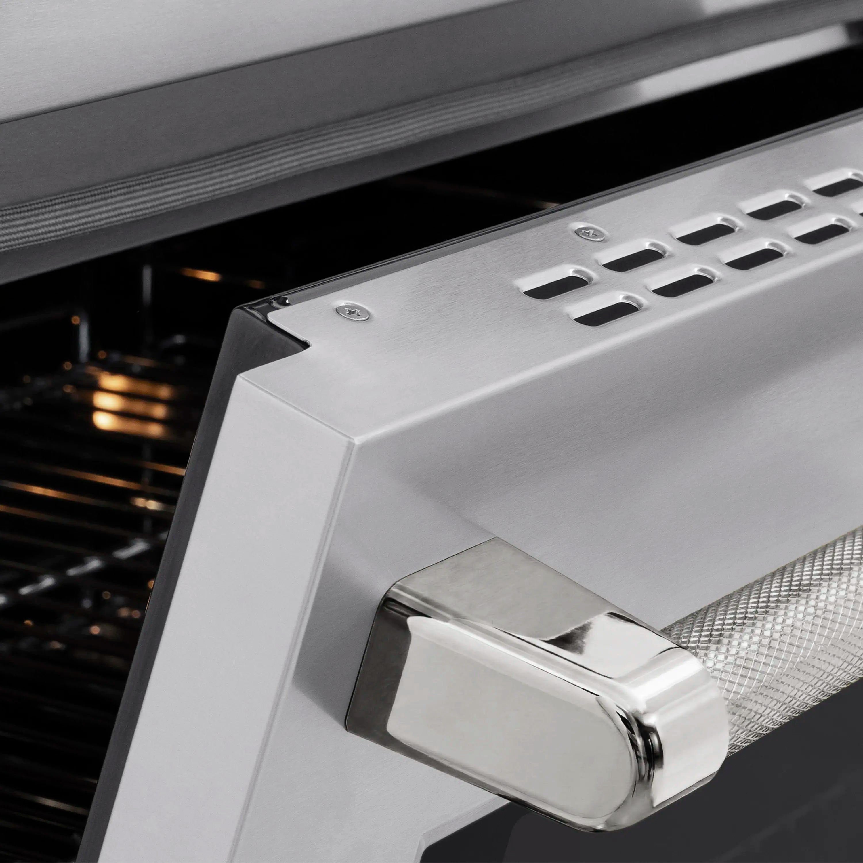 Stainless steel oven handle with polished nickel knob accents