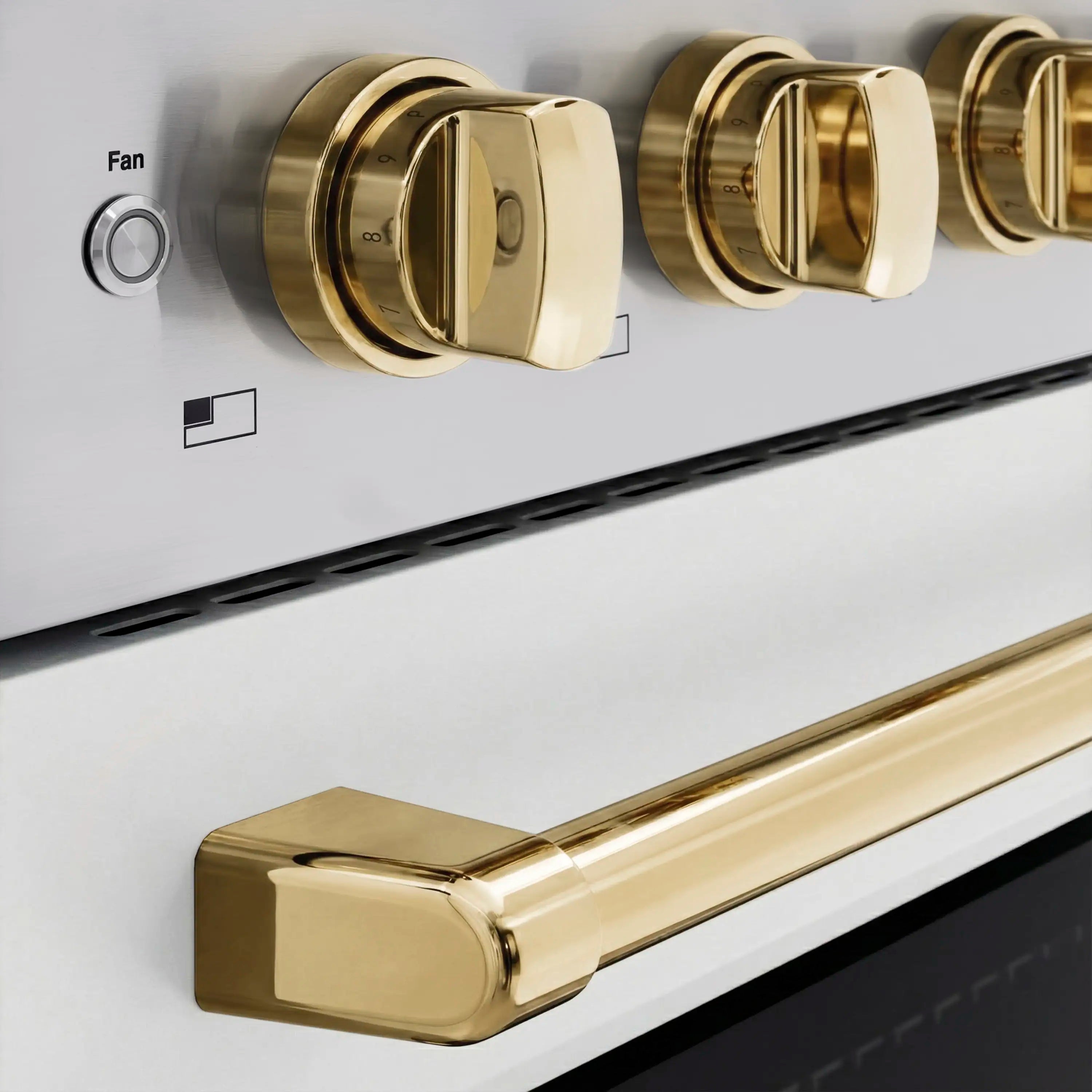 Stainless induction range control panel with gold knobs and black indicator icons