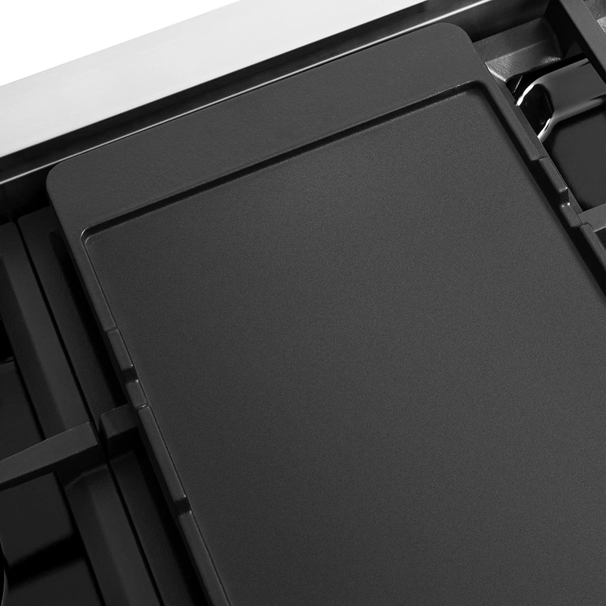 Smooth matte black burner cover with raised frame edge