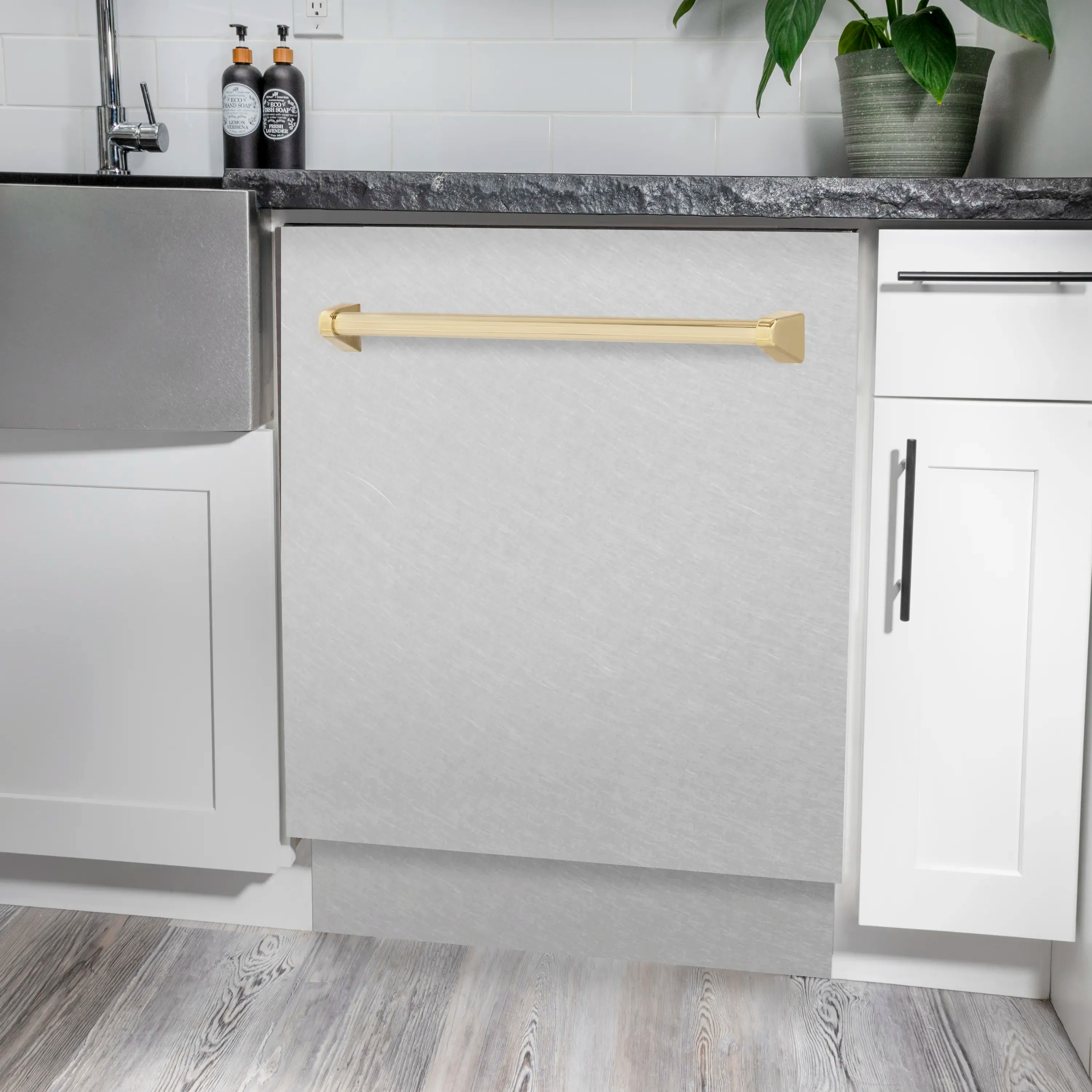 Tall dishwasher with satin stainless steel door and gold handle, door open