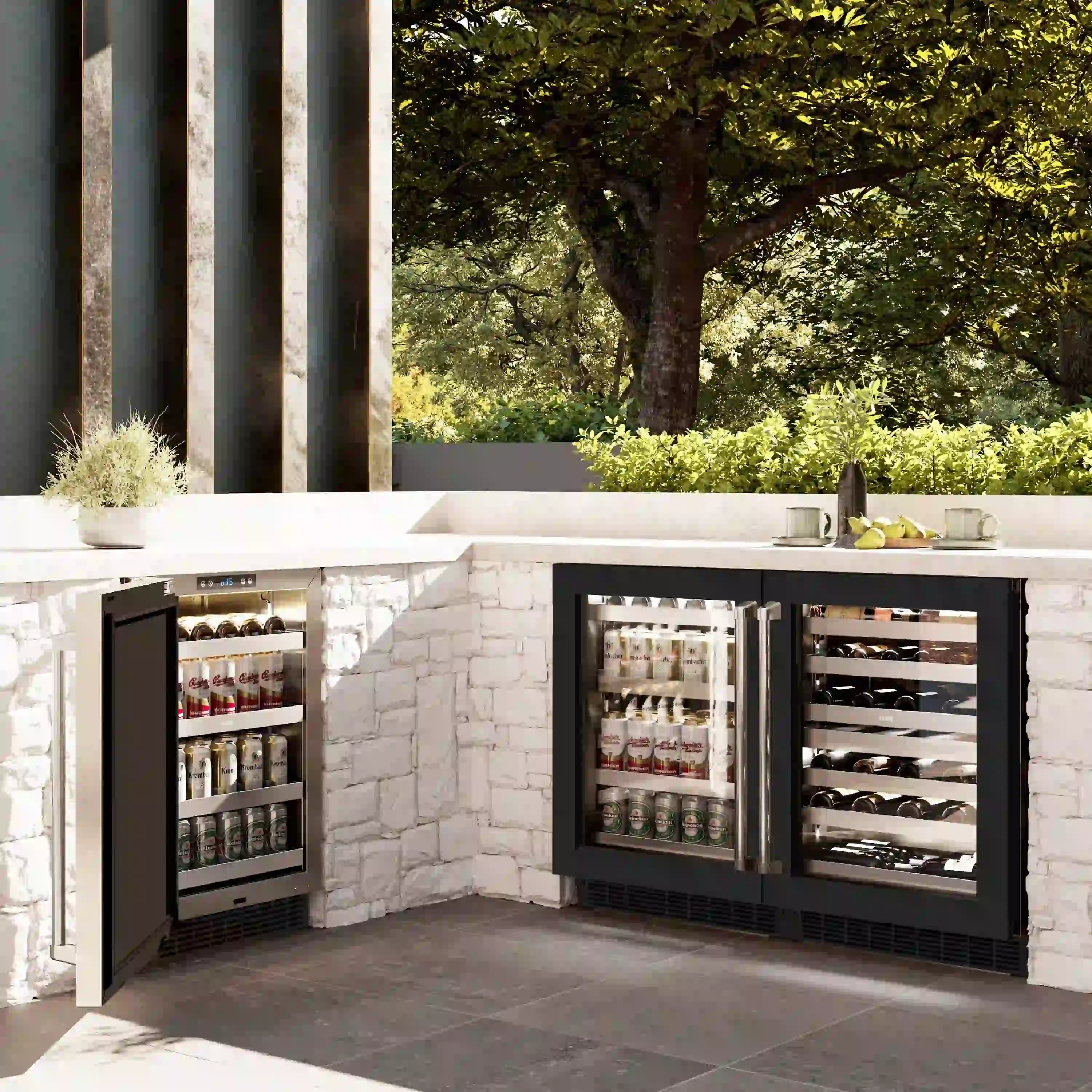 Outdoor built-in wine cooler pair with black frames and glass doors in a stone surround