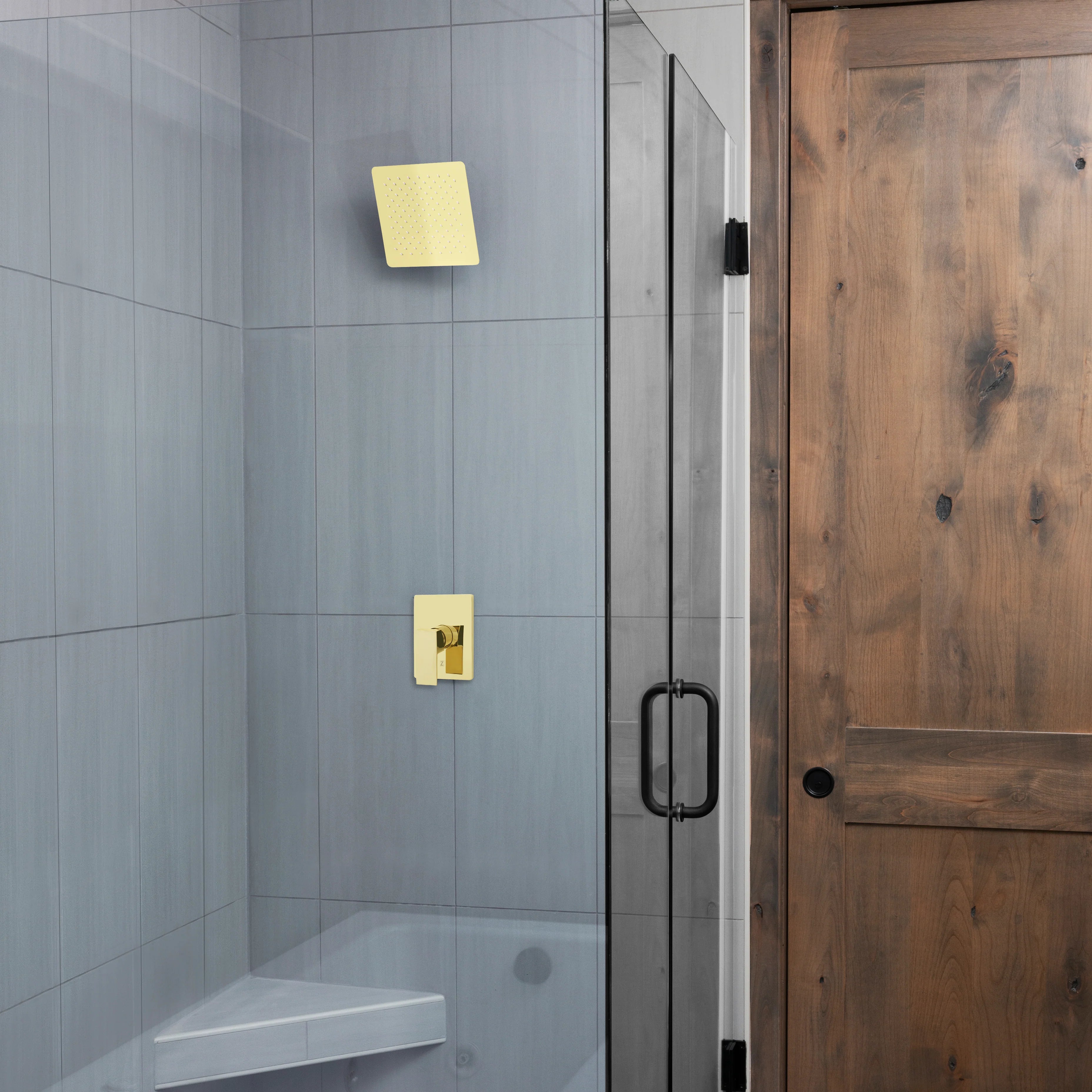 Polished gold wall-mount shower head with a square face and spray nozzles
