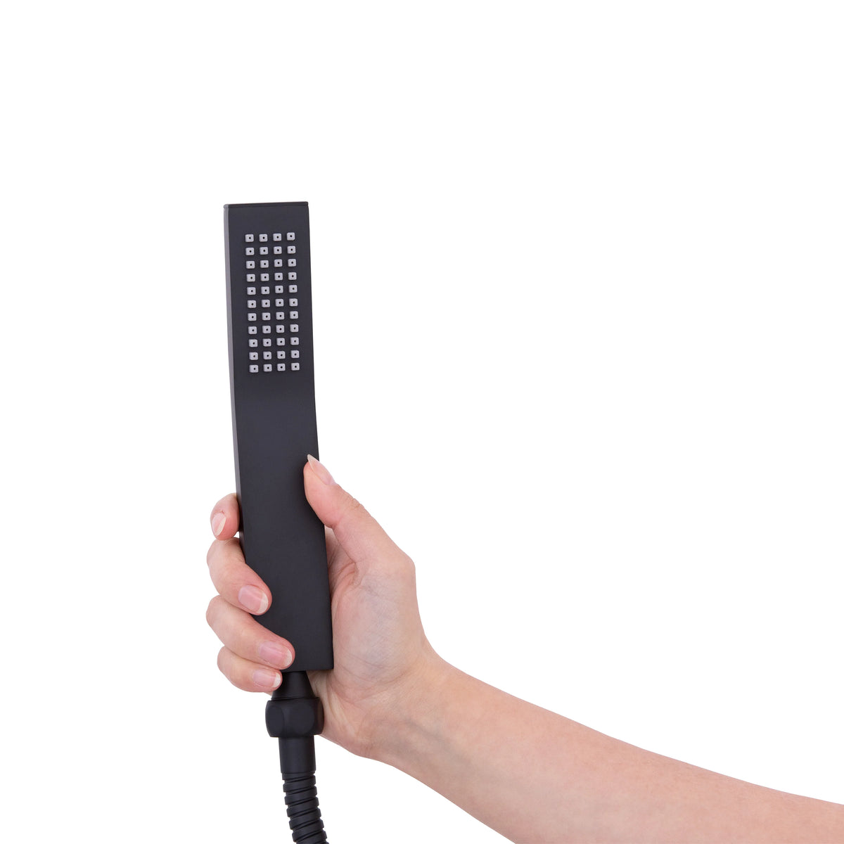Matte black handheld shower with holder and coiled hose, held in hand