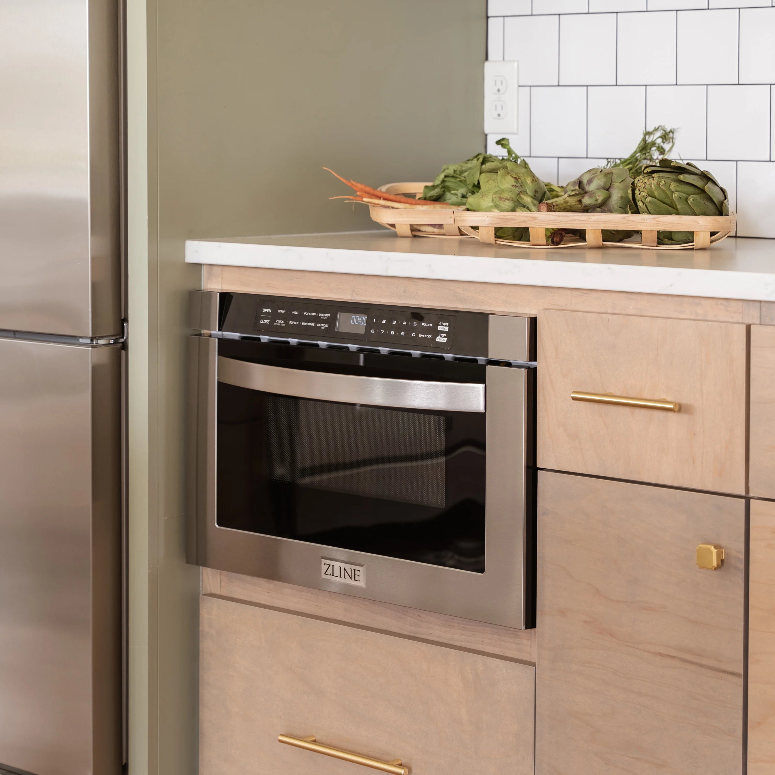 Stainless steel built-in microwave drawer with black glass door in wood cabinet frame