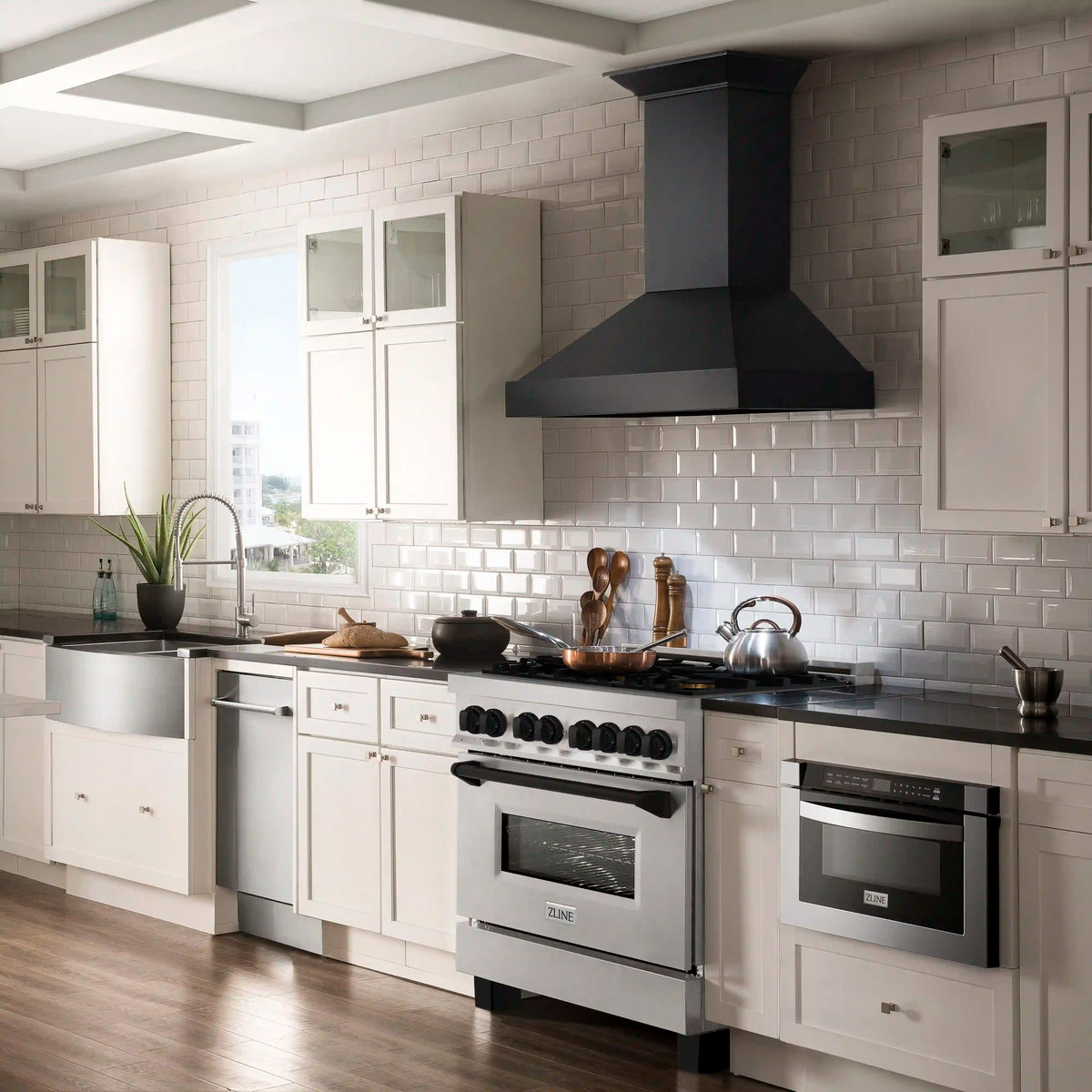 Satin stainless dual-fuel range with gas cooktop and black glass oven door