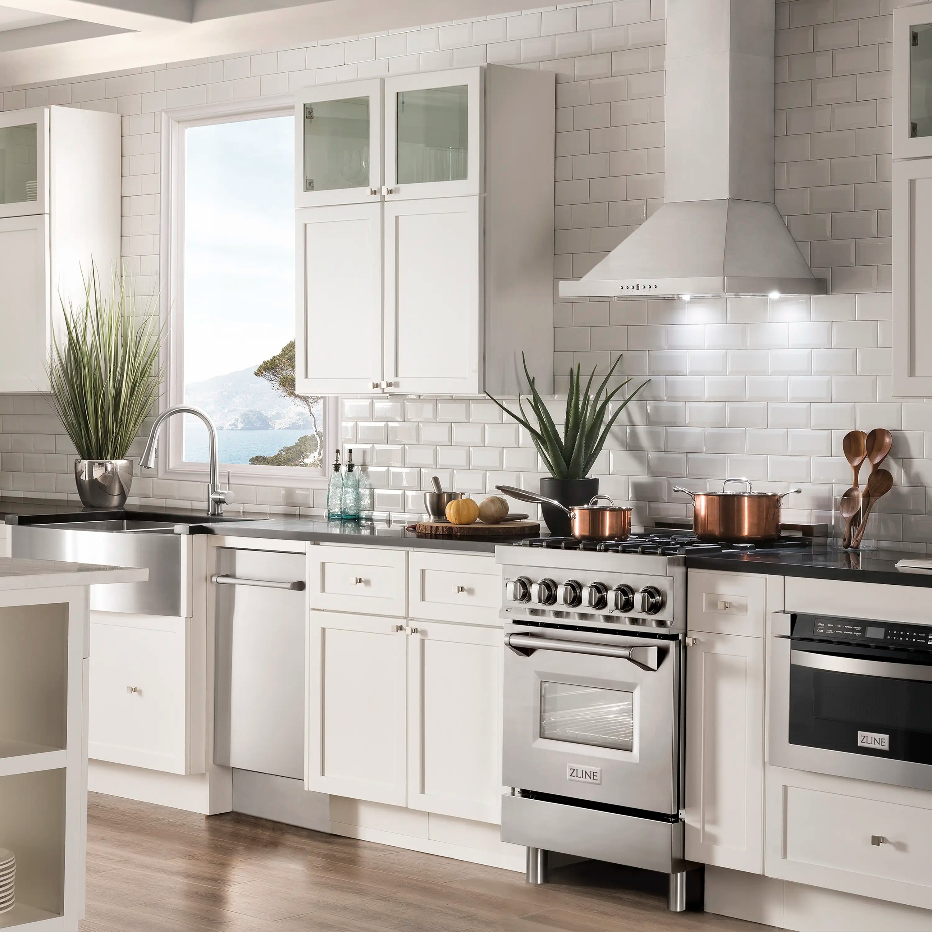 Stainless steel wall mount range hood mounted above the cooktop, chimney style