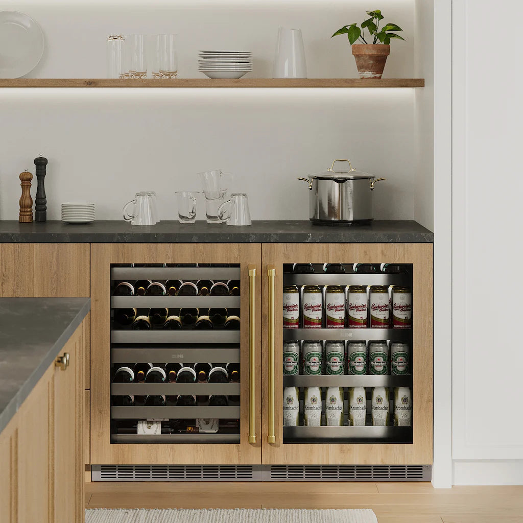 Built-in beverage fridge with wood cabinetry, bottle and can storage shelves