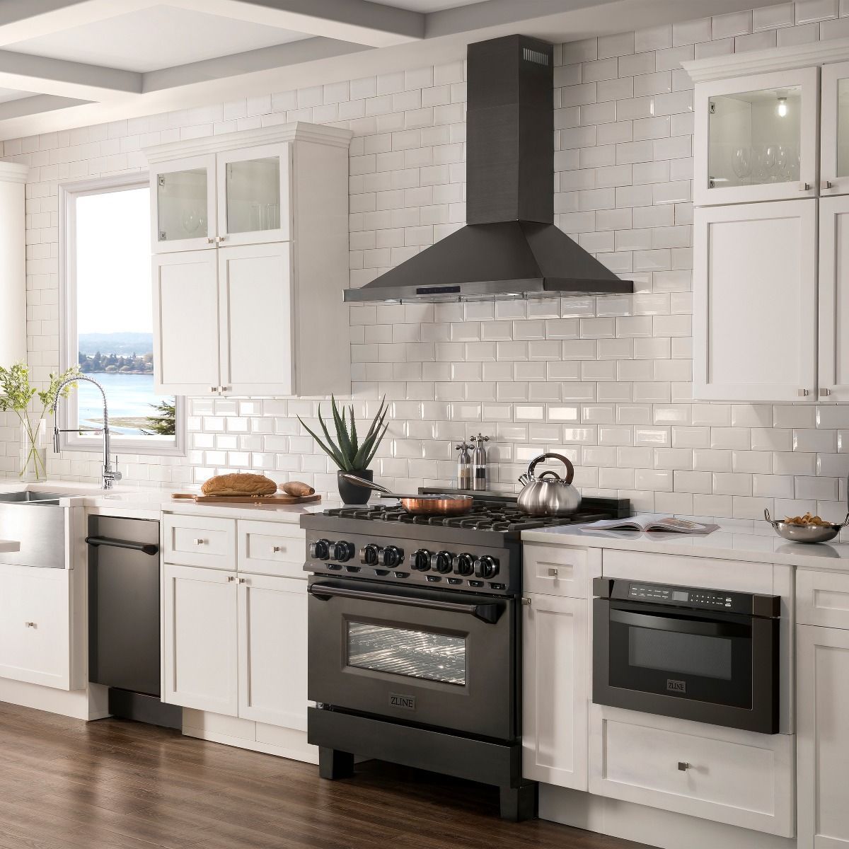 Black convertible range hood above a built-in cooktop in a kitchen