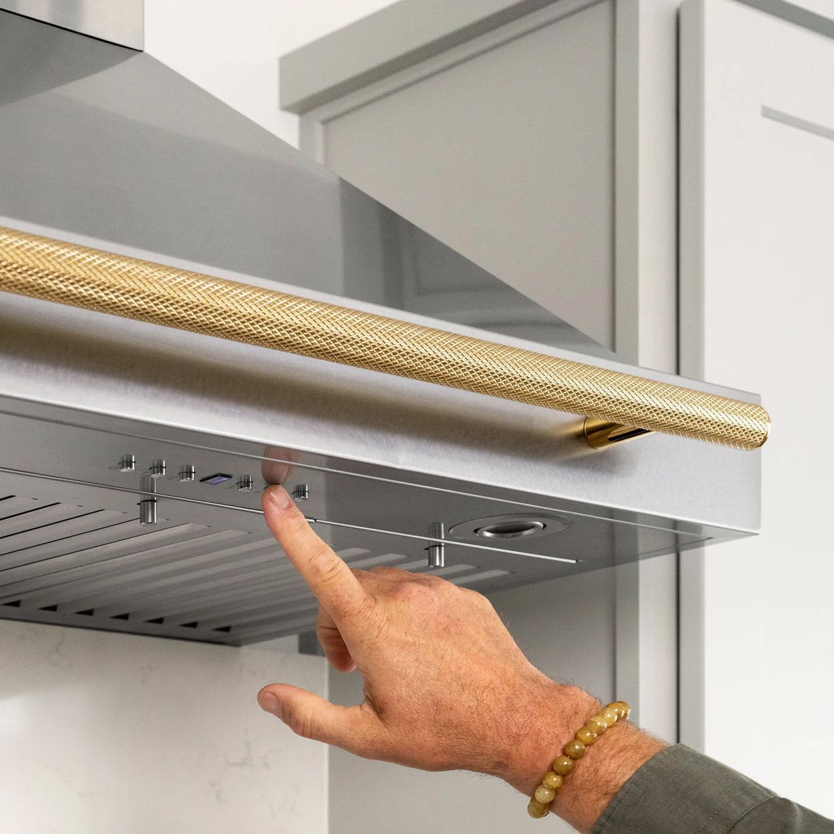 ZLINE Autograph Edition Wall Mount Range Hood Helix Handle in Polished Gold
